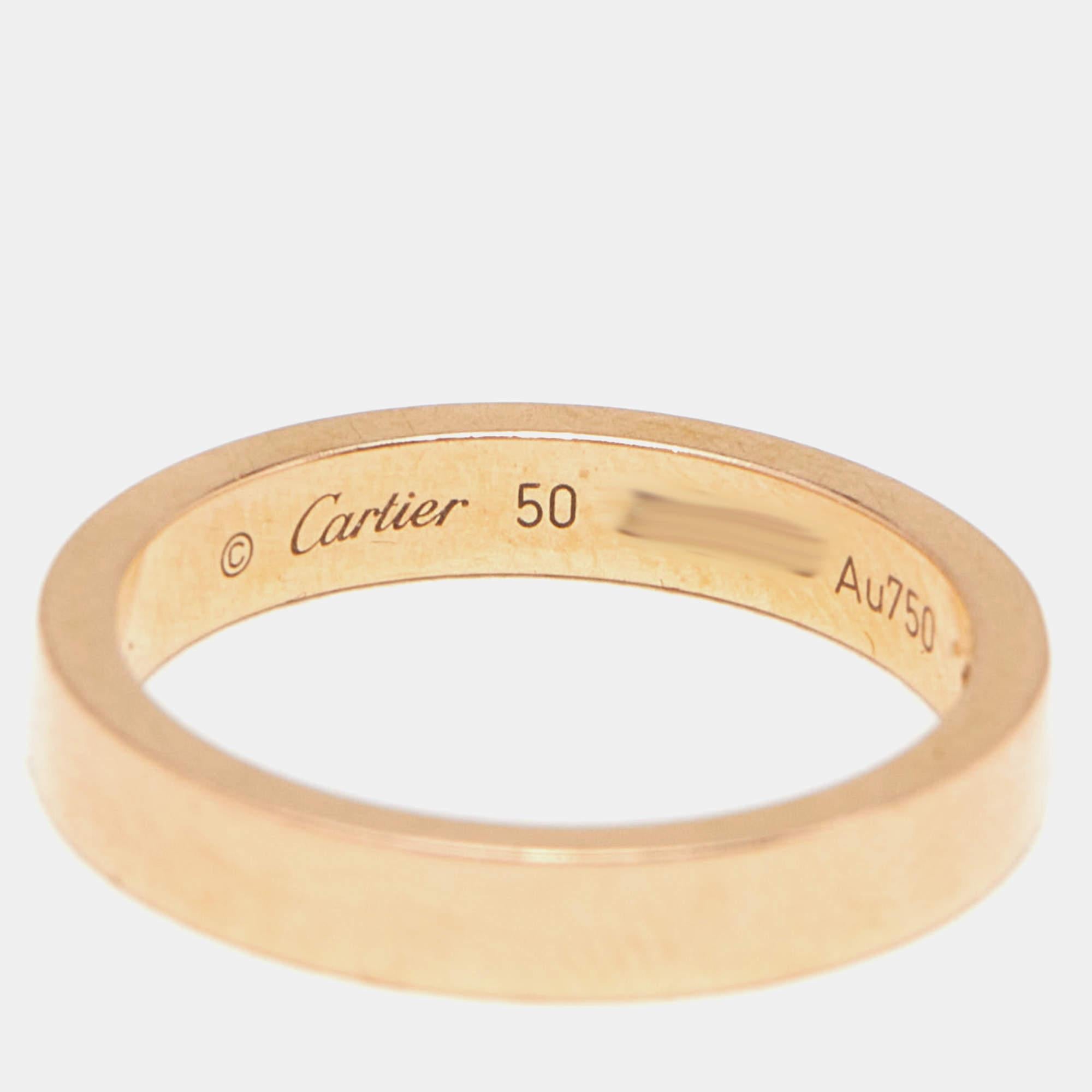 Let this C de Cartier band ring be a favored choice when it comes to choosing a ring for daily wear. The ring is made from 18k rose gold and is highlighted by brand engravings and a single diamond. It will be a prized accessory you will love wearing