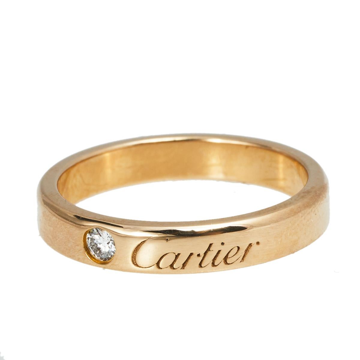 Let this C de Cartier band ring be a favored choice when it comes to choosing a wedding or engagement ring. The ring is made from 18k rose gold and highlighted by a diamond and brand engravings. It will be a prized accessory you will love wearing