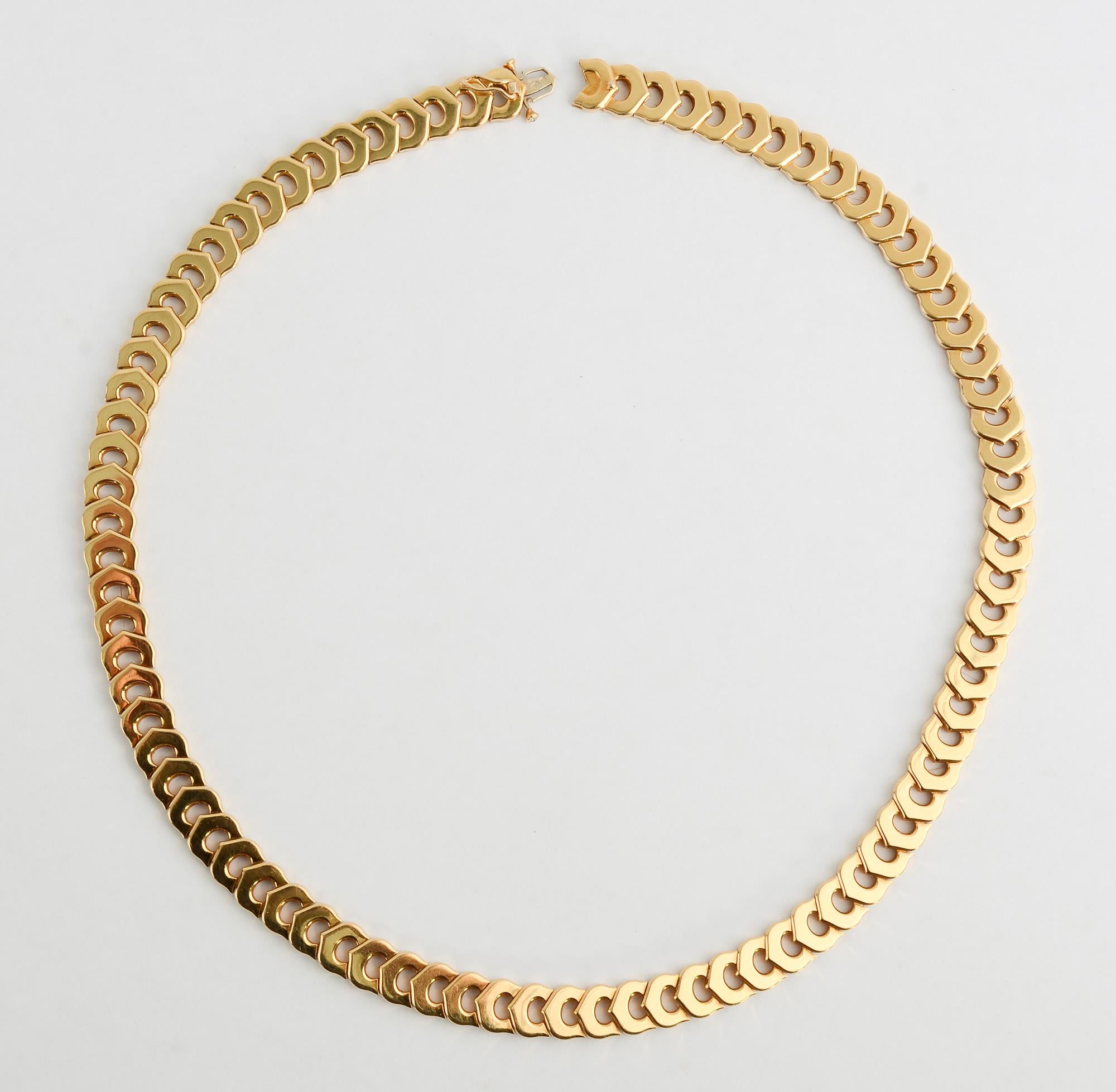 Elegant and understated C de Cartier 18 karat gold choker necklace by Cartier. For those in the know, the interlocking Cartier C's are evident but they can also look like interesting shaped  links unrelated to the logo.
The necklace measures 17 1/8