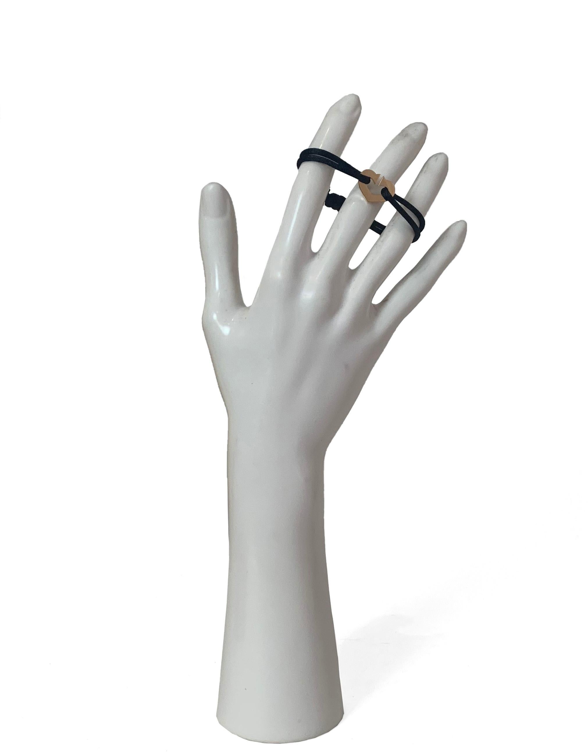 Cartier C de Cartier Heart 18k Pink/Rose Gold Black Adjustable Cord Bracelet

Materials: 18k pink gold, cord
Hallmarks: Cartier DG6645 750
Closure/Opening: Slip on
Overall Condition:
Includes: Cartier pouch

Measurements:
Circumference/Length: up to