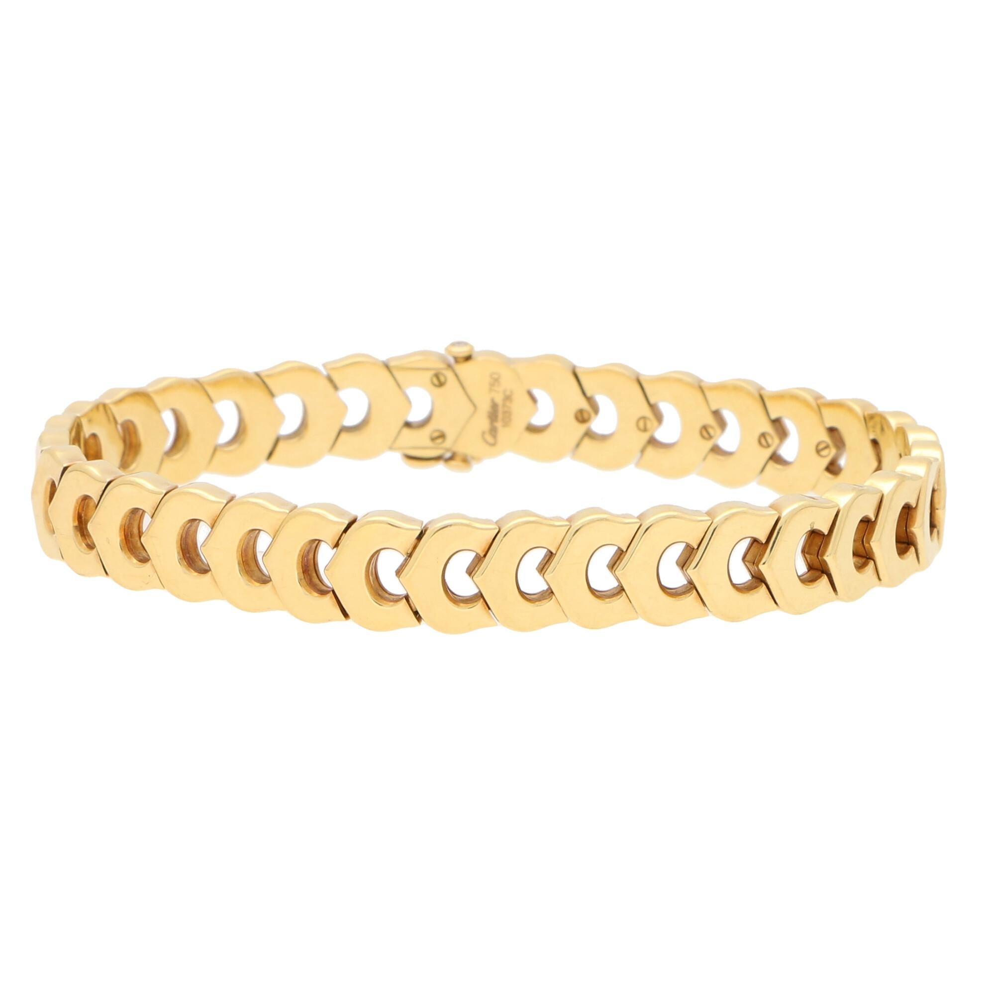 A beautiful C de Cartier link bracelet made of solid 18k yellow gold 

The bracelet is composed of exactly 35 iconic Cartier C links and sits beautifully on the wrist. Due to the design of the bracelet it could easily be worn by itself as a stand