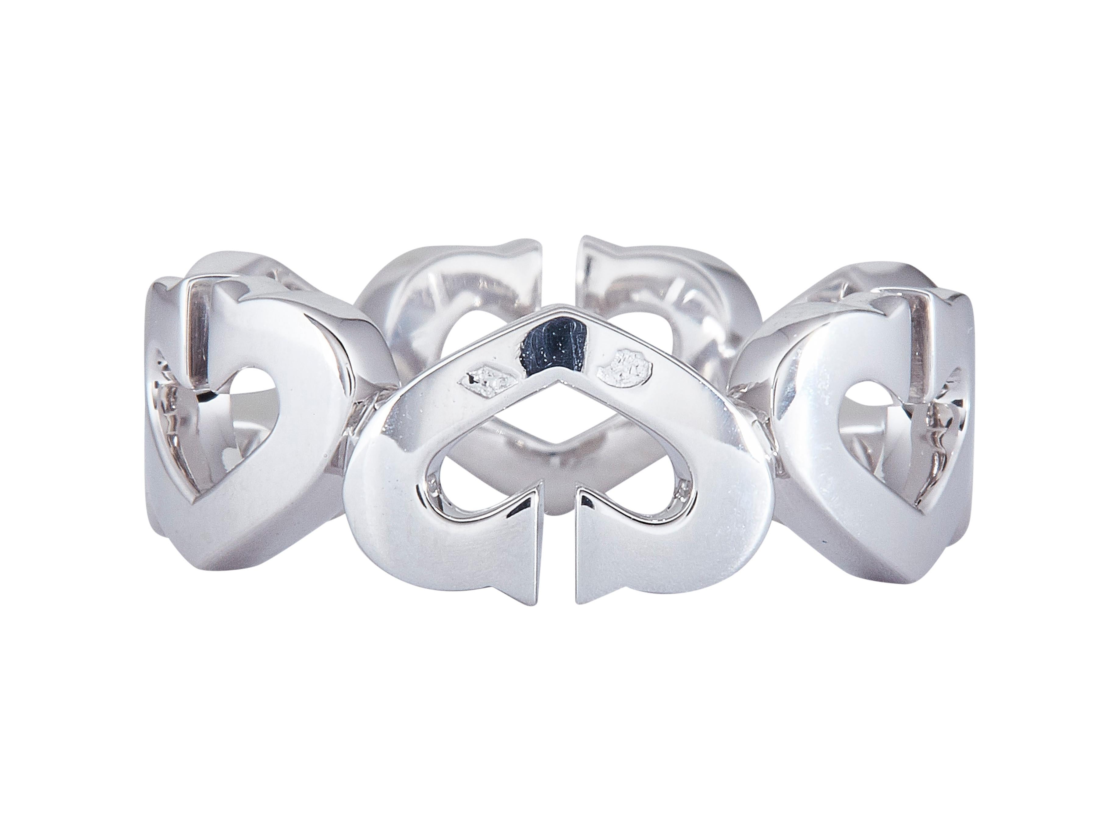 The ring: A Cartier C de Cartier ring in eighteen karat white gold set with round brilliant cut diamonds.

Accompanied by…
Original box
Service paperwork

The ring is in excellent condition, with only a few minor scratches that are expected with