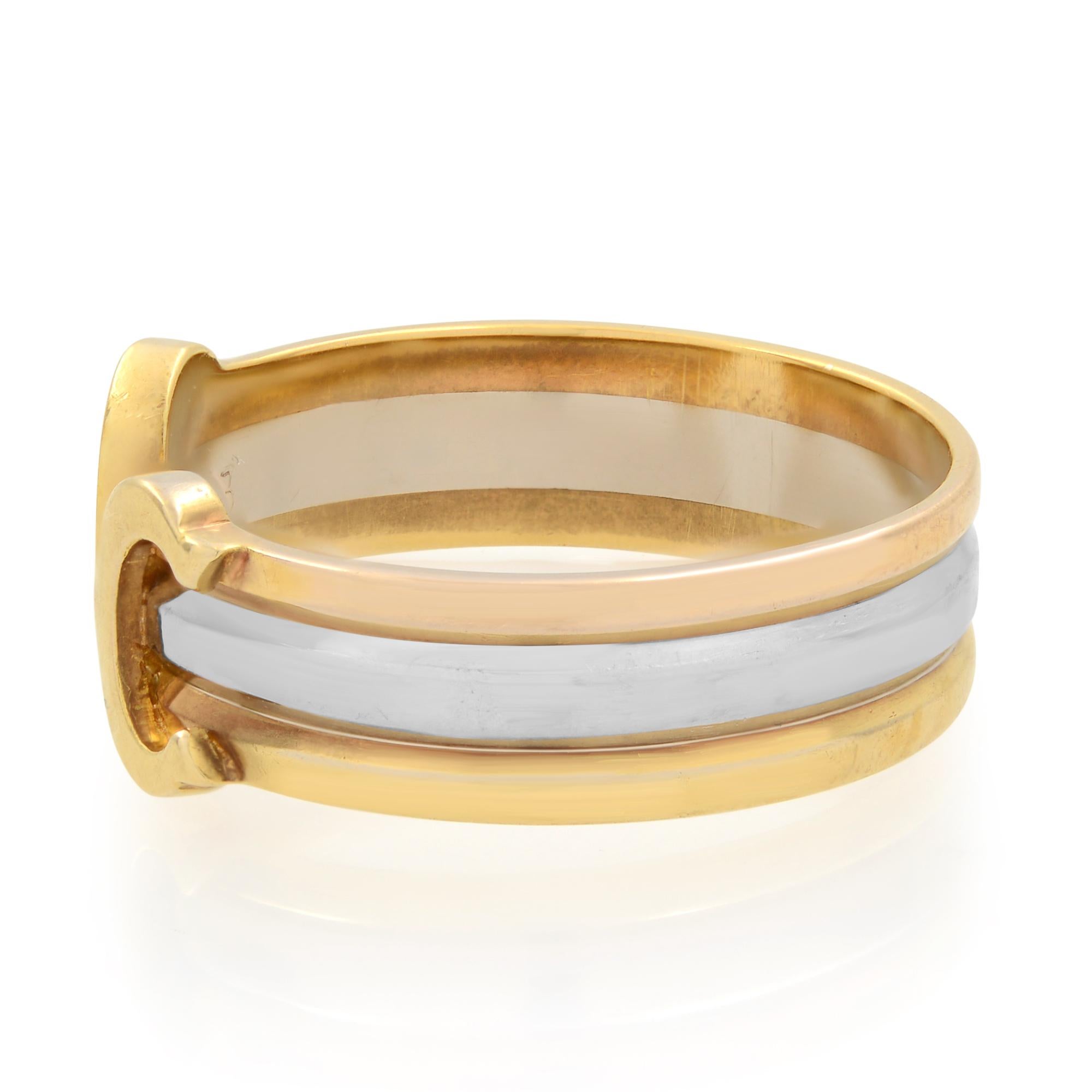 Cartier C De Cartier ring crafted in 18k rose, white and yellow gold. The open shank ring is comprised of three bands of tri color gold. Cartier's trademark C shape is featured at each end of the split facing inward. The ring is stamped 750 and