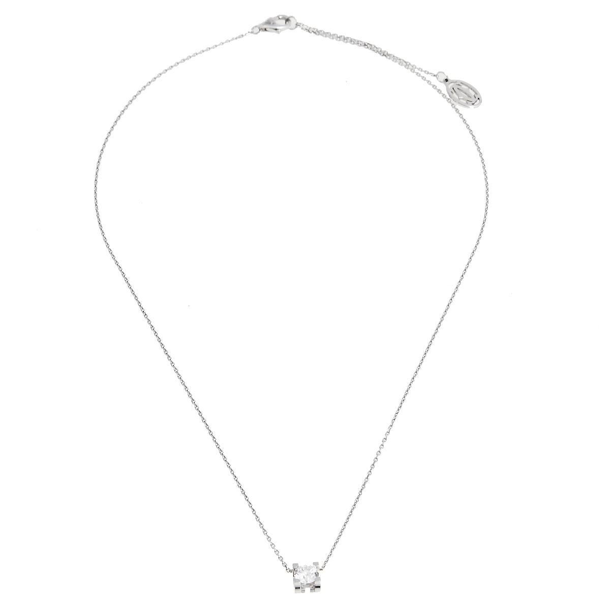 This C de Cartier piece is a beauty to behold. It has been crafted out of 18k white gold and styled with a simple chain that holds a single solitaire diamond pendant. The diamond weighs 0.53 ct and is stationed in a four-prong setting. It also