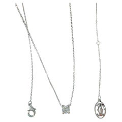 Collier Cartier « C DE CARTIER » en or blanc avec un diamant unique en forme de tête de taureau