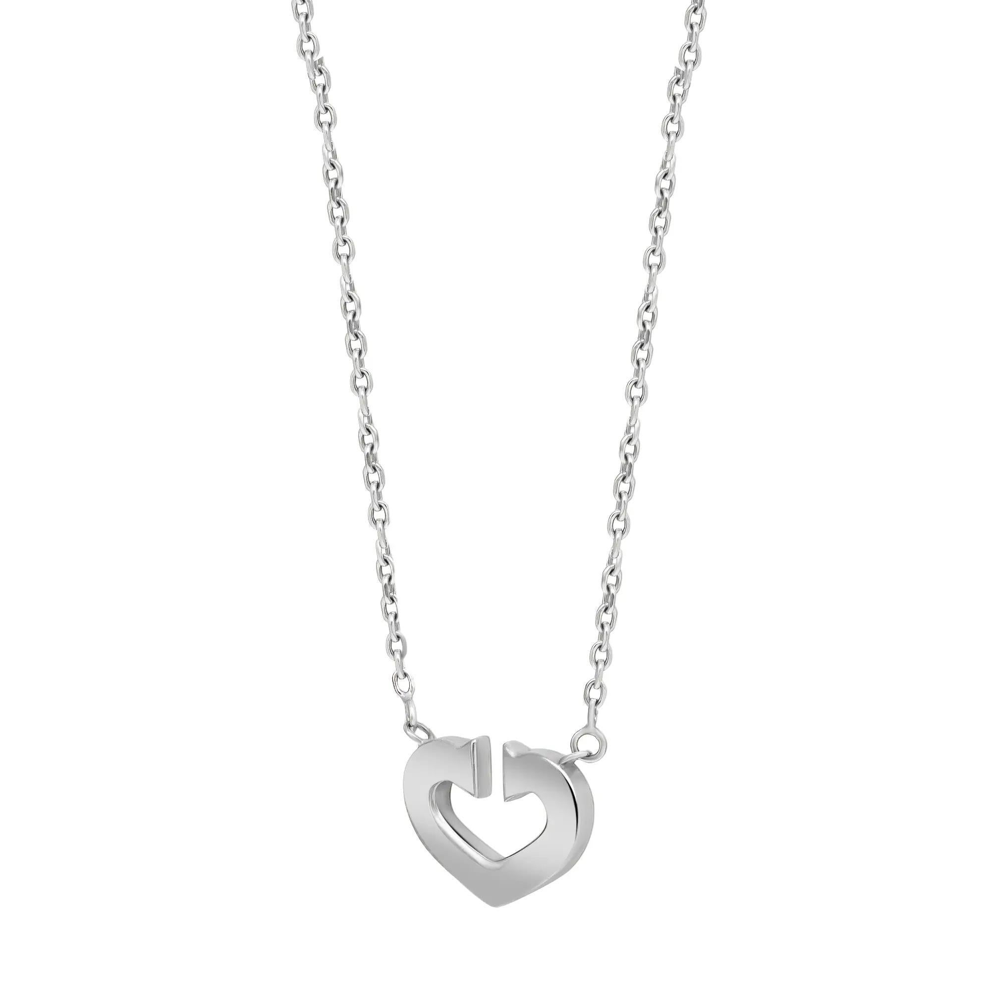 Cartier C Heart De Cartier pendant necklace crafted in 18K white gold. This necklace is from the Heart and Symbols Cartier collection. A precious heart pendant necklace accompanied with an adjustable cuban link chain with Cartier stamp on the clasp.