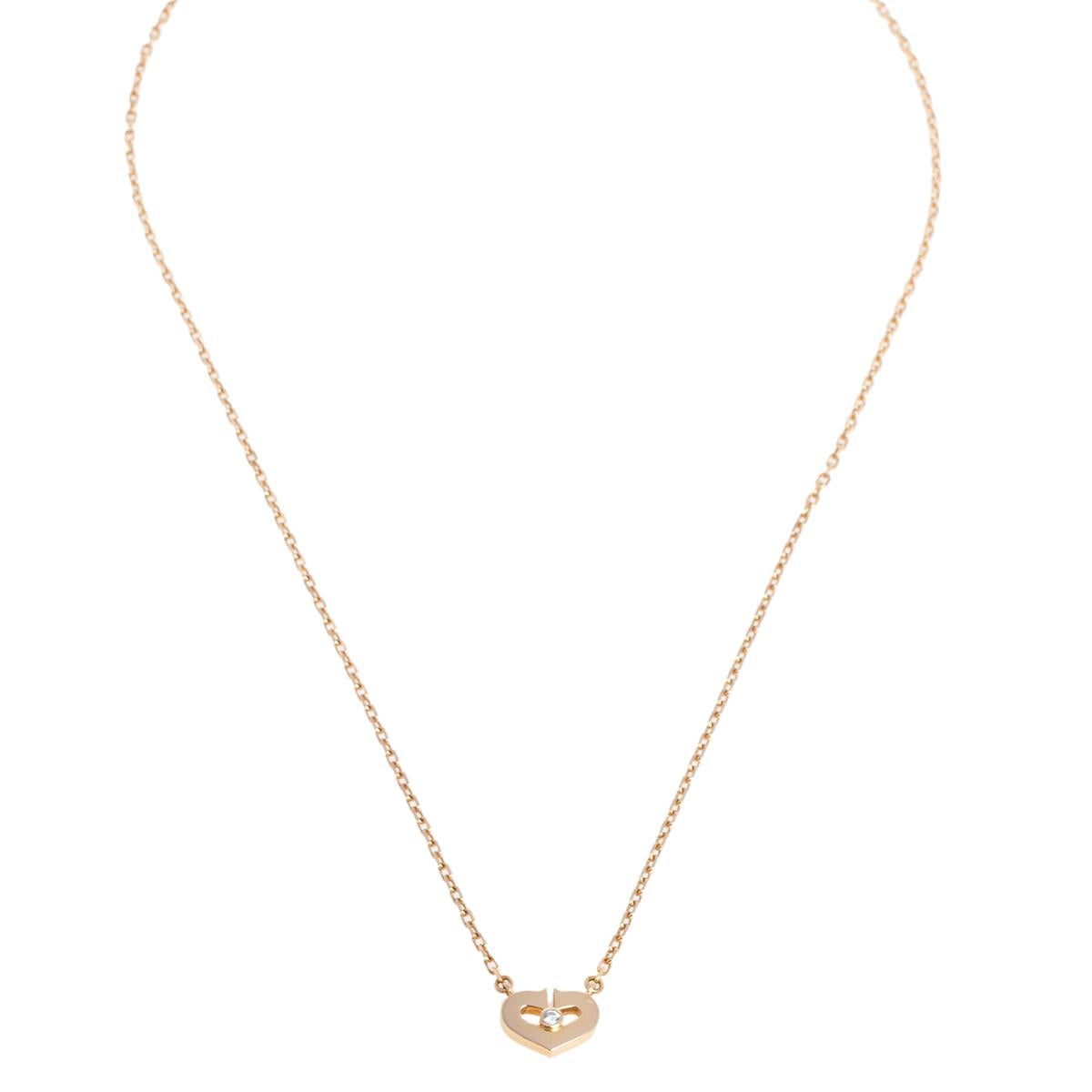 Cartier's C Heart of Cartier necklace is an elegant piece of jewelry that can be sported with everyday ensembles for a subtly chic look. It has an open heart-shaped fixed pendant that exudes a polished finish and has a single diamond at the center.
