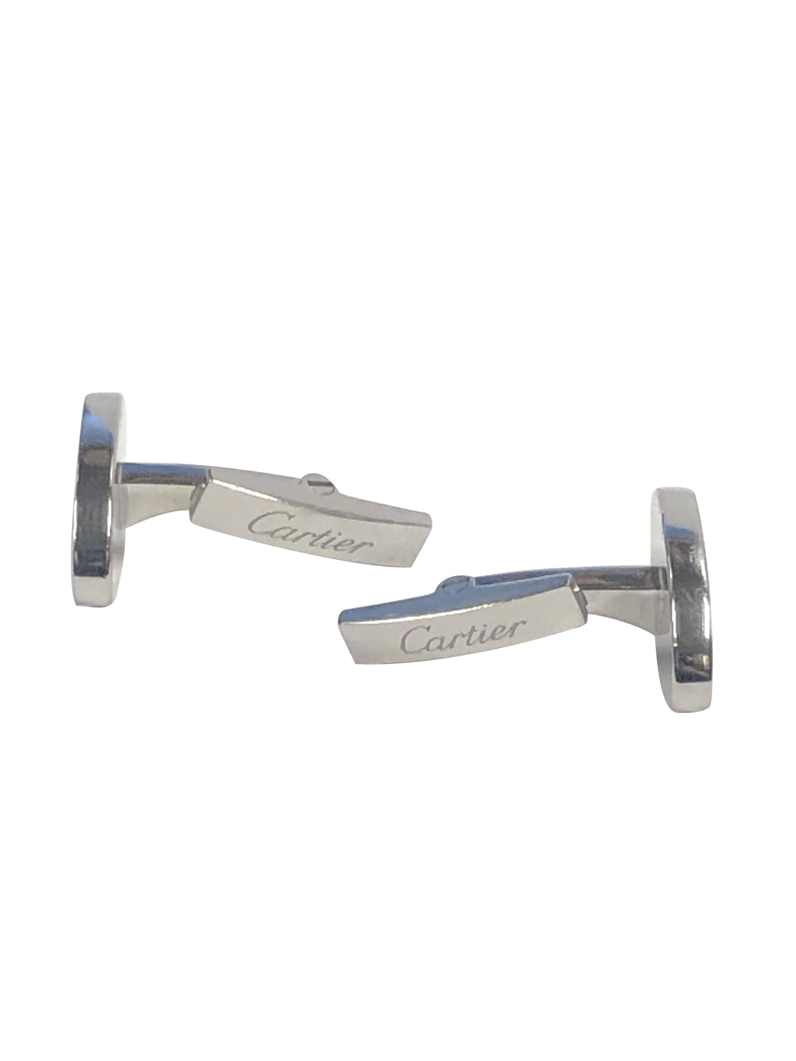Circa 2015 Cartier C logo Sterling Silver Cufflinks, the oval tops measure 3/4 X 3/8 inch, finished in Black enamel and have the double C logo in the center. Toggle backs for easy on and off. Come in original Cartier Presentation box.  