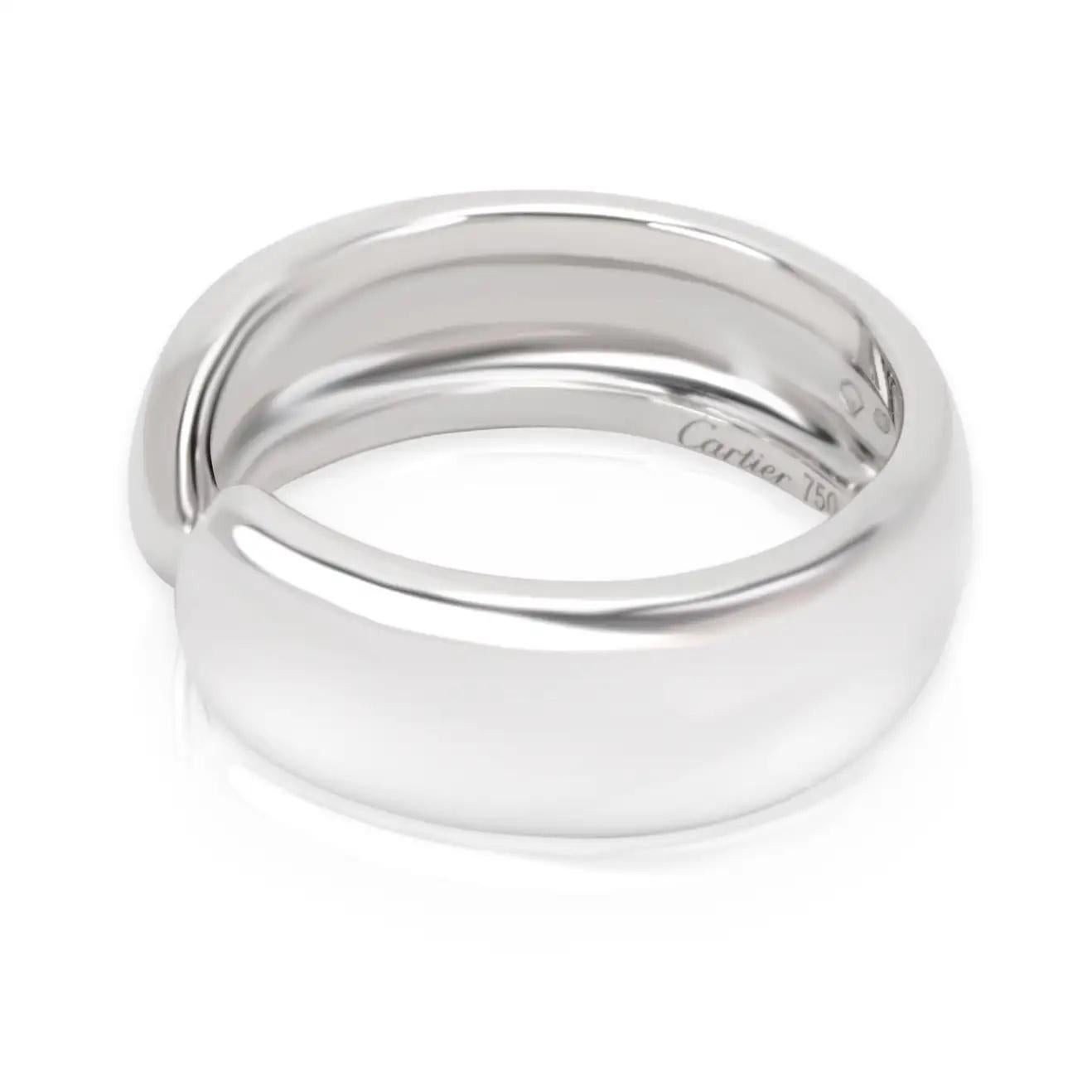 This classy Cartier C profile ring has a timeless feel and appeal. Featuring a high polished embellished C logo at the sides of each opening this 18k white gold ring is a classic piece of jewelry that will always remain in style. The ring weighs