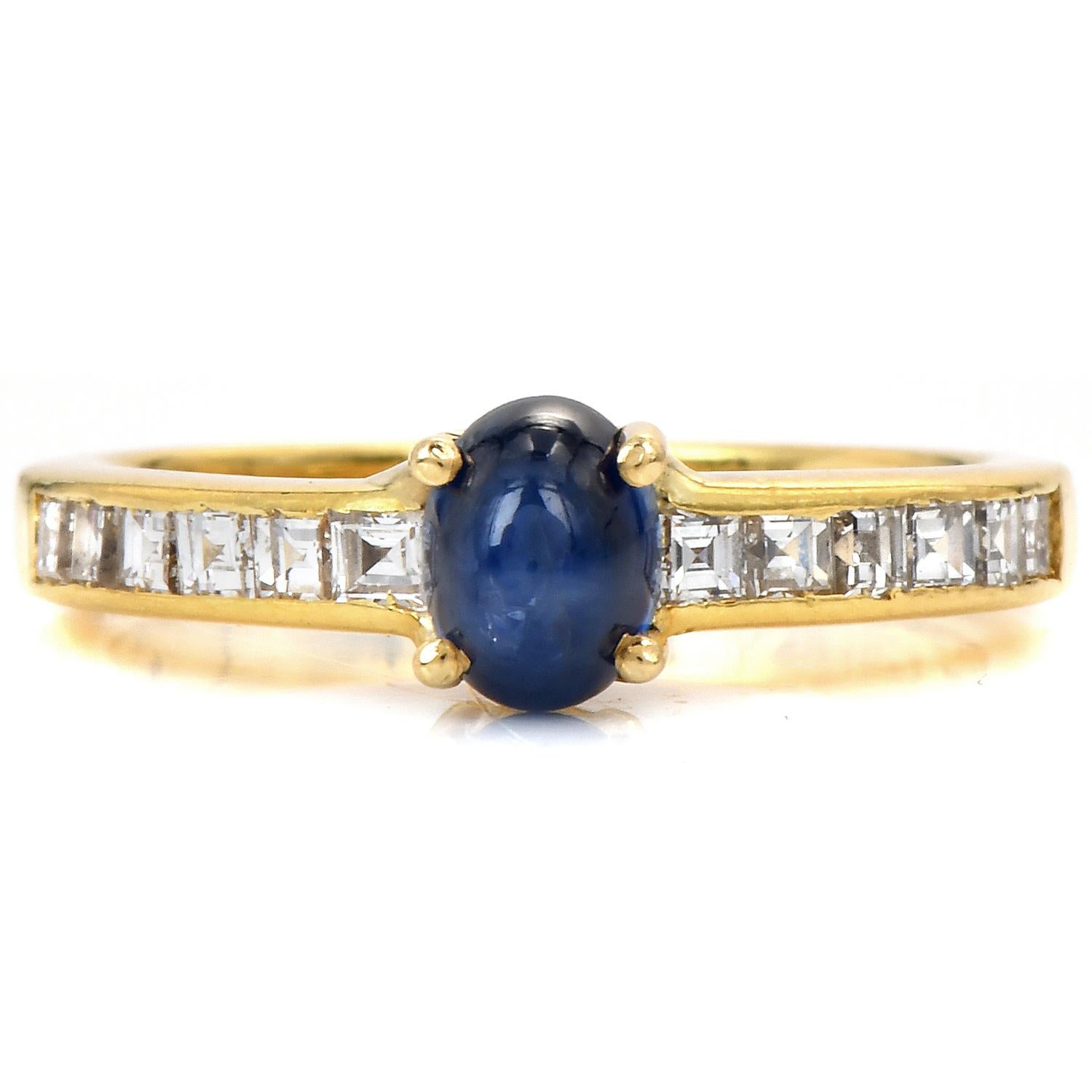 A lovely romantic Cartier's vintage ring.

Crafted in solid 18K Yellow Gold, all original.

Centered by a cabochon Genuine Blue Star Sapphire, Cabochon Oval cut, prong set, 1.00 carats.

Bringing life to the piece, are 12 Square Asscher-Cut, channel