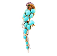 CARTIER Cabochon Turquoise, Diamond, Ruby and Emerald Parrot Brooch
