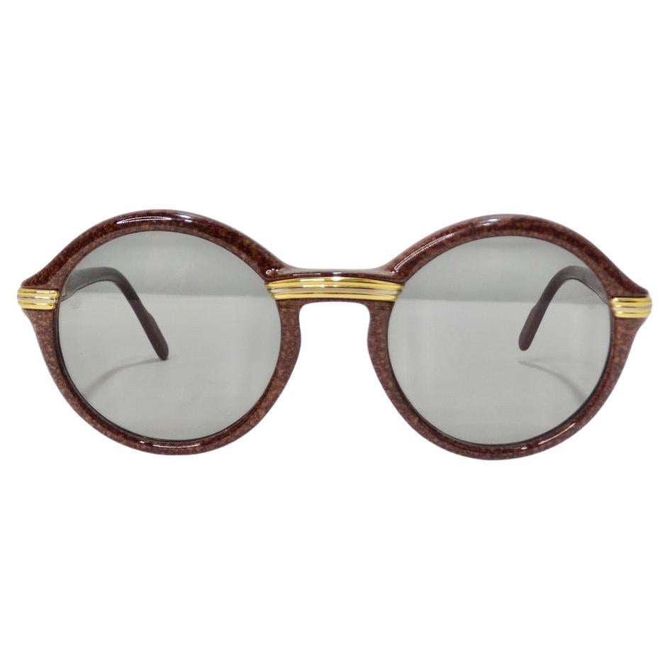 These vintage Cartier Cabriolet brown 22K gold sunglasses are perfect for anyone who loves a round frame! Super fun rounded style in a rich brown marble polycarbonate complimented by yellow gold accents and Cartier signatures. The Cabriolet is