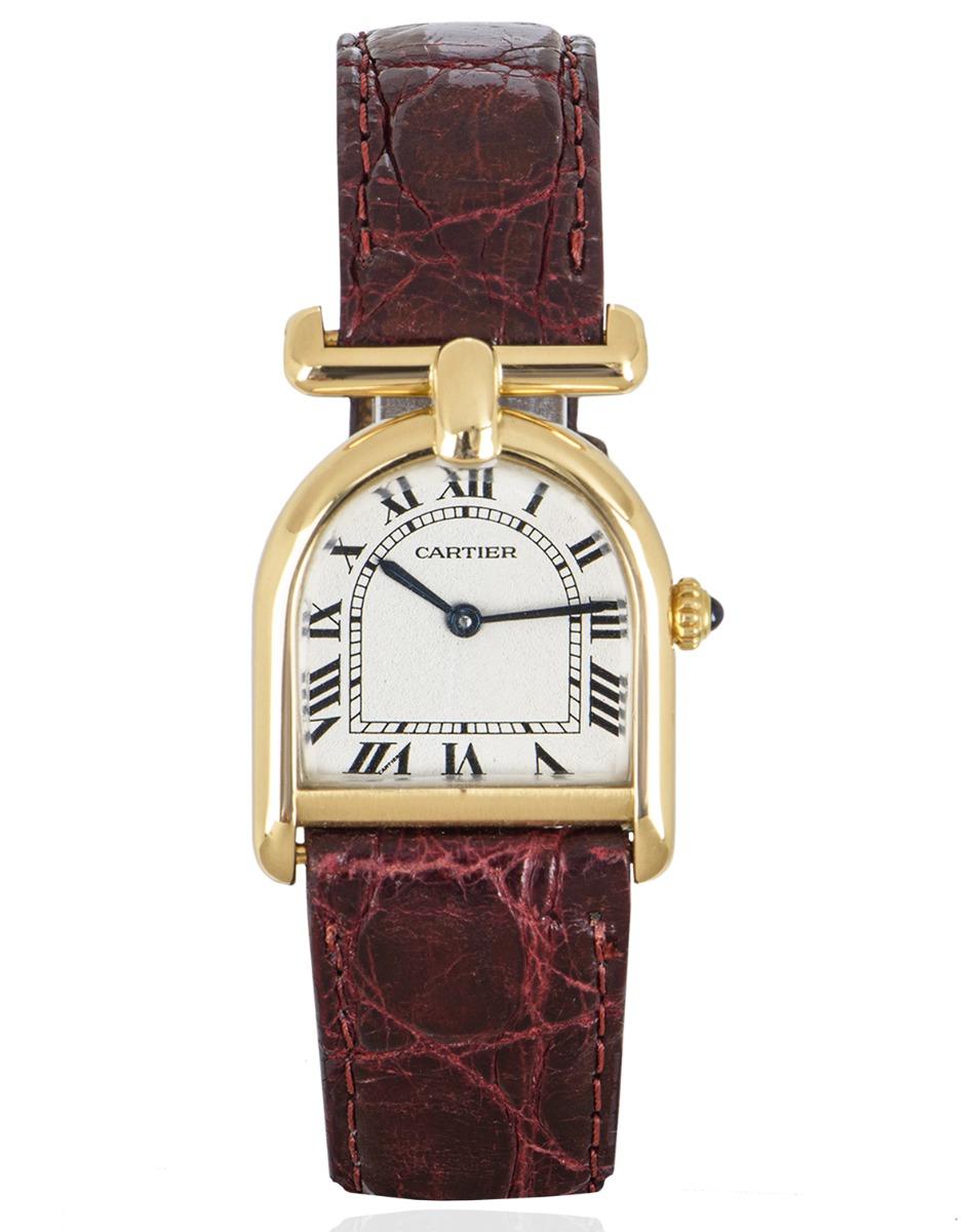 A 22.5mm vintage ladies Calandre crafted in yellow gold by Cartier. Featuring a guilloche white dial with roman numerals, blued steel sword shaped hands, Cartier's own hidden signature at 'VII' and a crown set with a single cabochon.

Fitted with a
