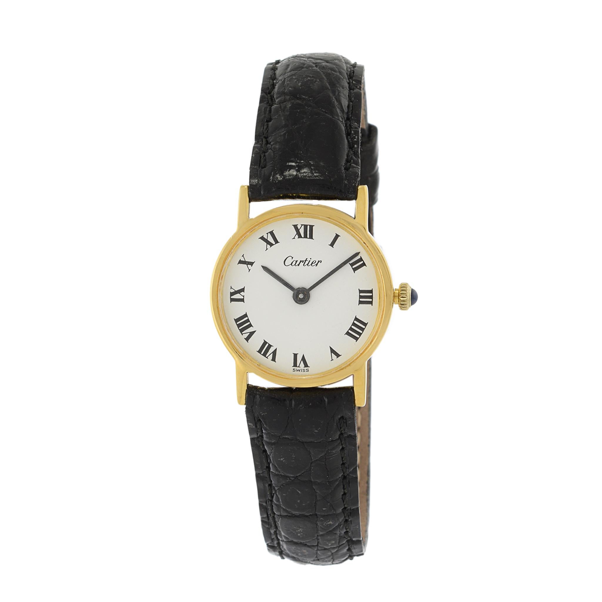 This is a 1980's Cartier Calatrava watch in vermeil. The case of this watch measures 24mm in diameter.

The watch is powered by a Cartier manual wind movement. It has been serviced.

The dial of the watch is white this black Roman numeral hour