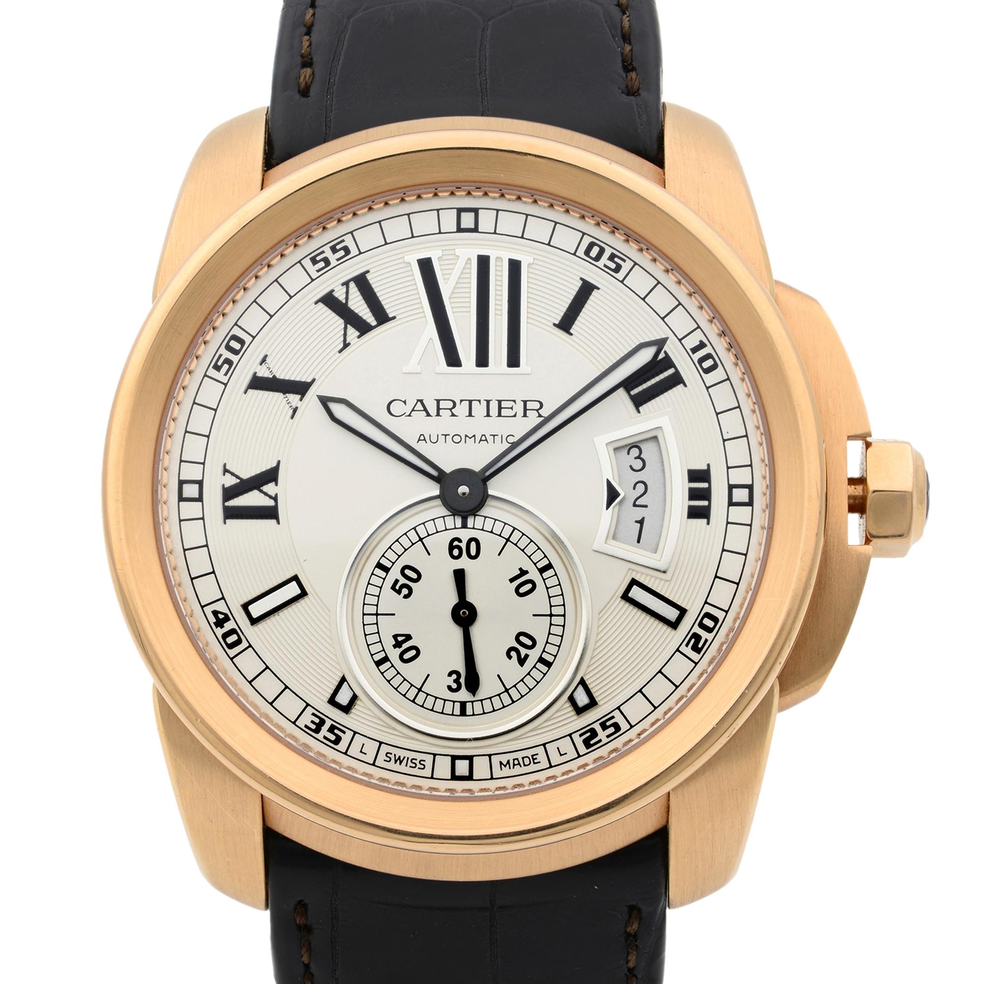 This pre-owned Cartier Calibre De Cartier  W7100009 is a beautiful men's timepiece that is powered by mechanical (automatic) movement which is cased in a rose gold case. It has a round shape face, date indicator, small seconds subdial dial and has