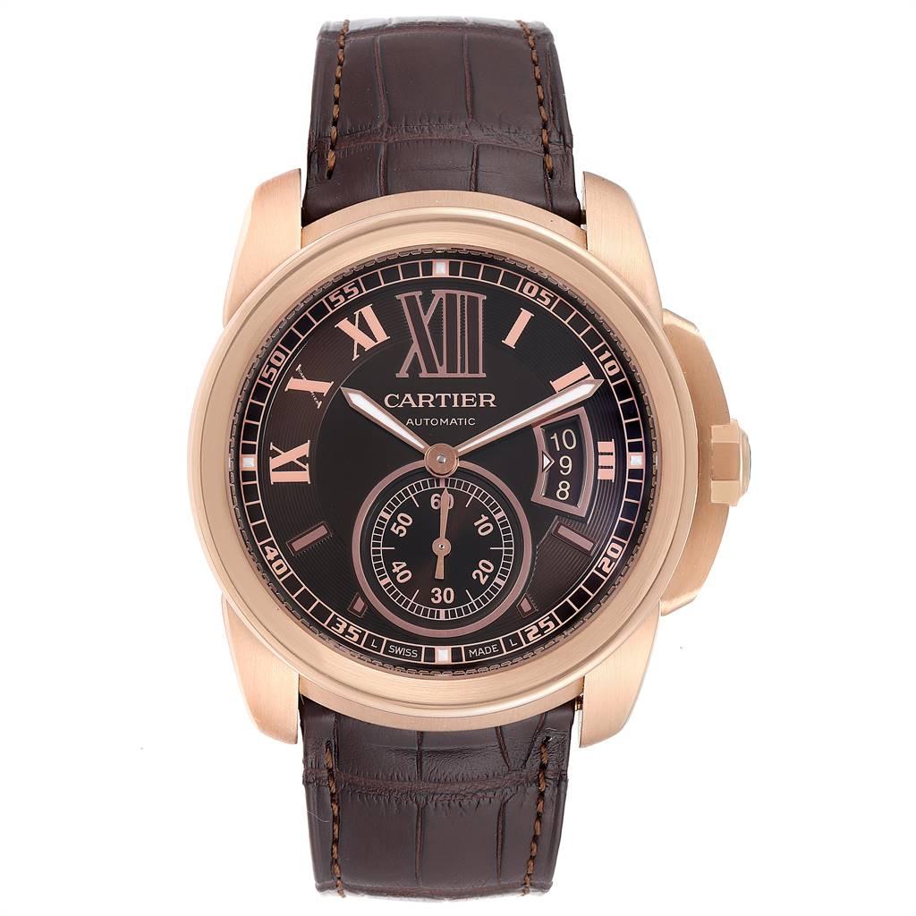 Cartier Calibre Rose Gold Brown Dial Automatic Mens Watch W7100007. Automatic self-winding movement. 18K rose gold round case 42 mm in diameter. 18K rose gold crown set with faceted blue sapphire. Exhibition skeleton sapphire crystal caseback. 18K