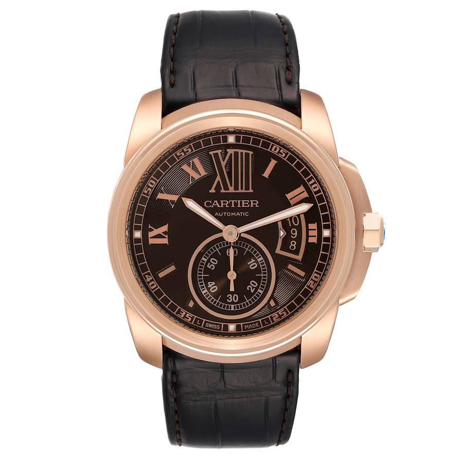 Cartier Calibre Rose Gold Brown Dial Automatic Mens Watch W7100007. Automatic self-winding movement. 18K rose gold round case 42 mm in diameter. 18K rose gold crown set with faceted blue sapphire. Exhibition skeleton sapphire crystal caseback. 18K