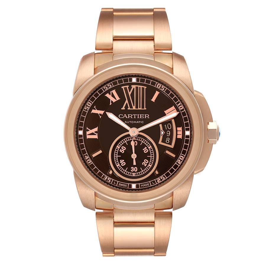 Cartier Calibre Rose Gold Brown Dial Automatic Mens Watch W7100040. Automatic self-winding movement. 18K rose gold round case 42 mm in diameter. 18K rose gold crown set with faceted blue sapphire. Exhibition skeleton sapphire crystal caseback. 18K