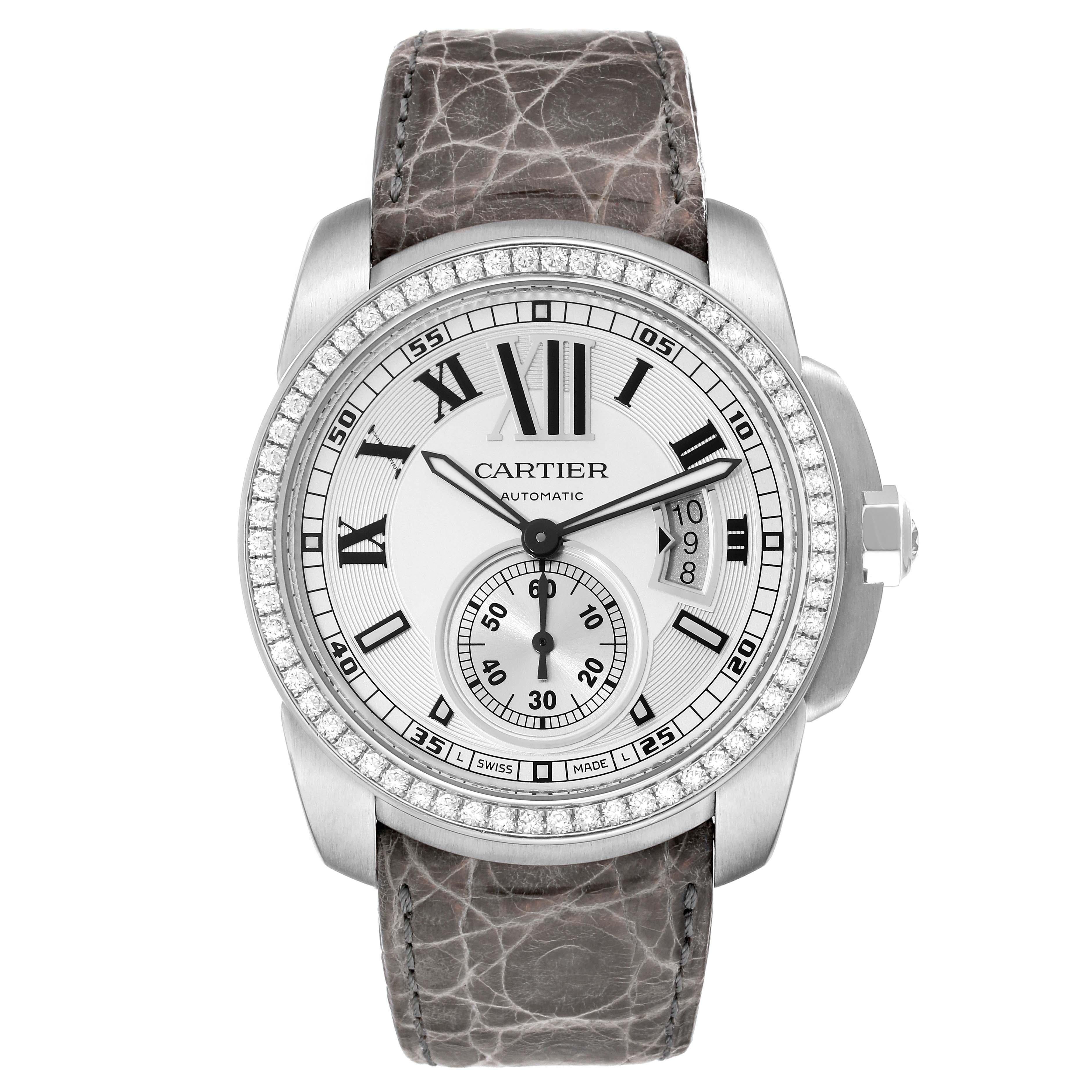 Cartier Calibre Silver Dial White Gold Diamond Mens Watch WF100003. Automatic self-winding movement. 18k white gold case 42.0 mm in diameter. 18K white gold crown set with an original Cartier factory diamond.  Transparent exhibition sapphire crystal