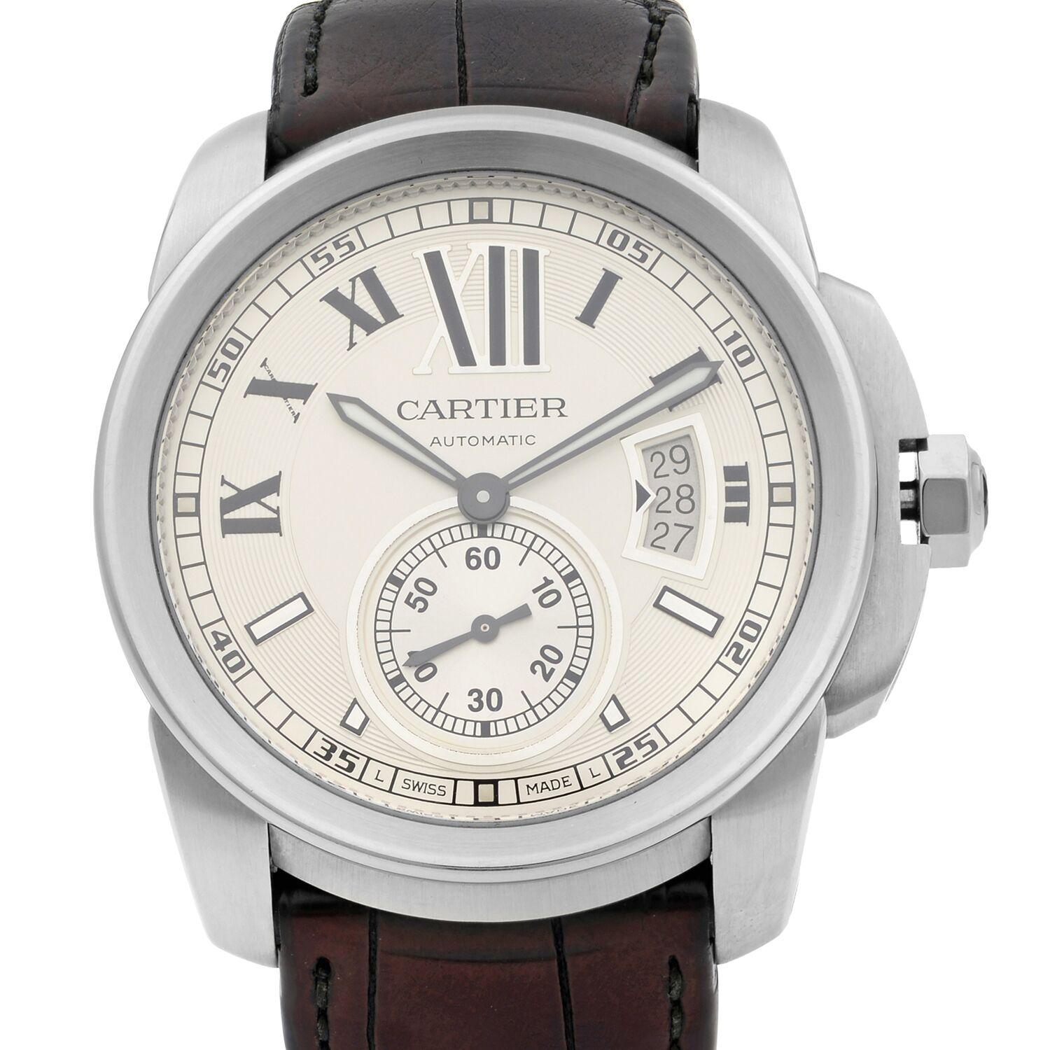This pre-owned Cartier Calibre De Cartier W7100037 is a beautiful men's timepiece that is powered by a mechanical (automatic) movement which is cased in a stainless steel case. It has a round shape face,  dial and has hand roman numerals, sticks