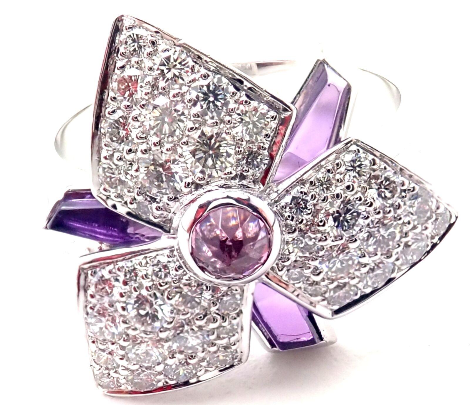 18k White Gold Diamond Amethyst Caresse D'orchidées Orchid Flower Ring by Cartier.
With Round brilliant cut diamonds VS1 clarity, E color total weight approx. .52ct
Amethysts
Details:
Size: European 49, US 4 3/4
Weight: 6.1 grams
Width: 