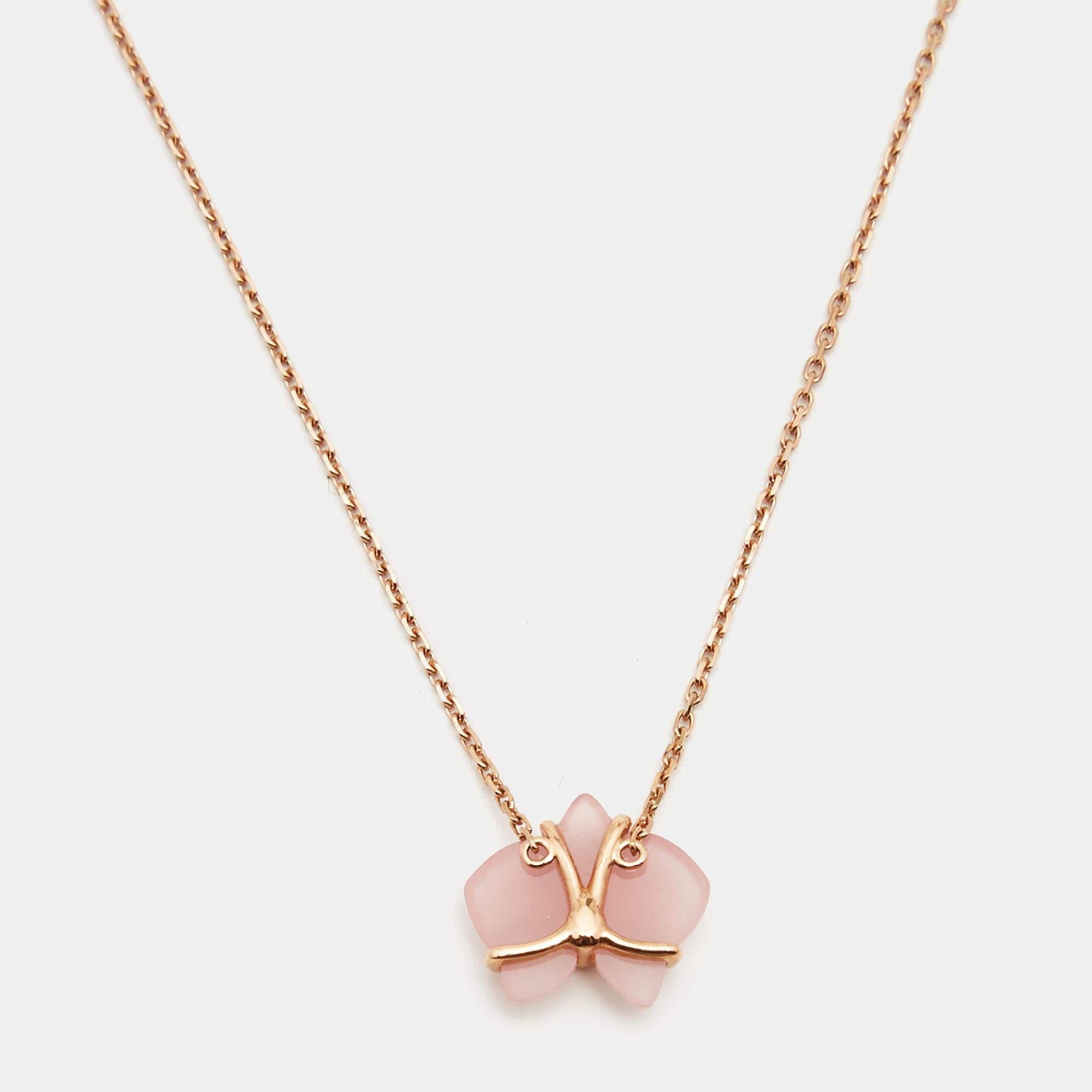 Cartier lovers will instantly recognize this Caresse d'Orchidees par necklace featuring the delicate orchid pendant rendered in pink chalcedony, as this popular flower is one of the classic motifs of the label's jewelry. An embodiment of feminine