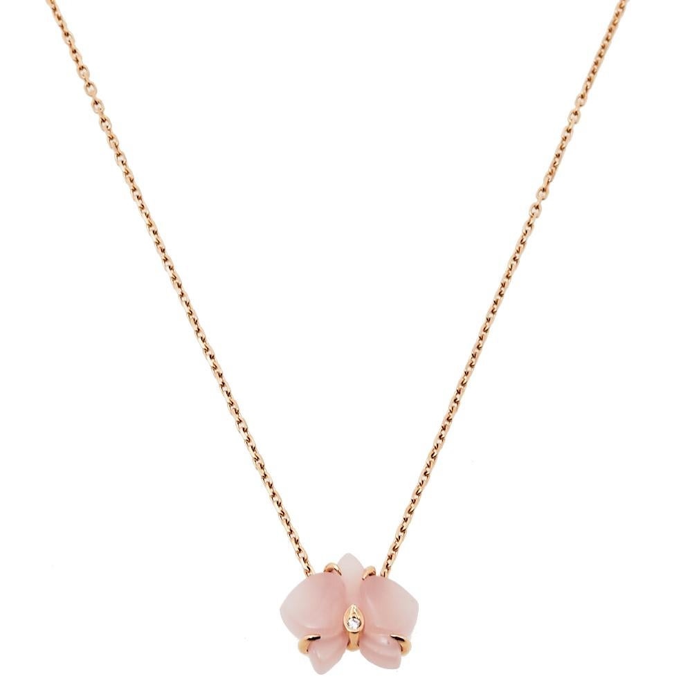 Cartier lovers will instantly recognize this Caresse d'Orchidees par necklace featuring the delicate orchid pendant rendered in pink chalcedony, as this popular flower is one of the classic motifs of the label's jewelry. An embodiment of feminine