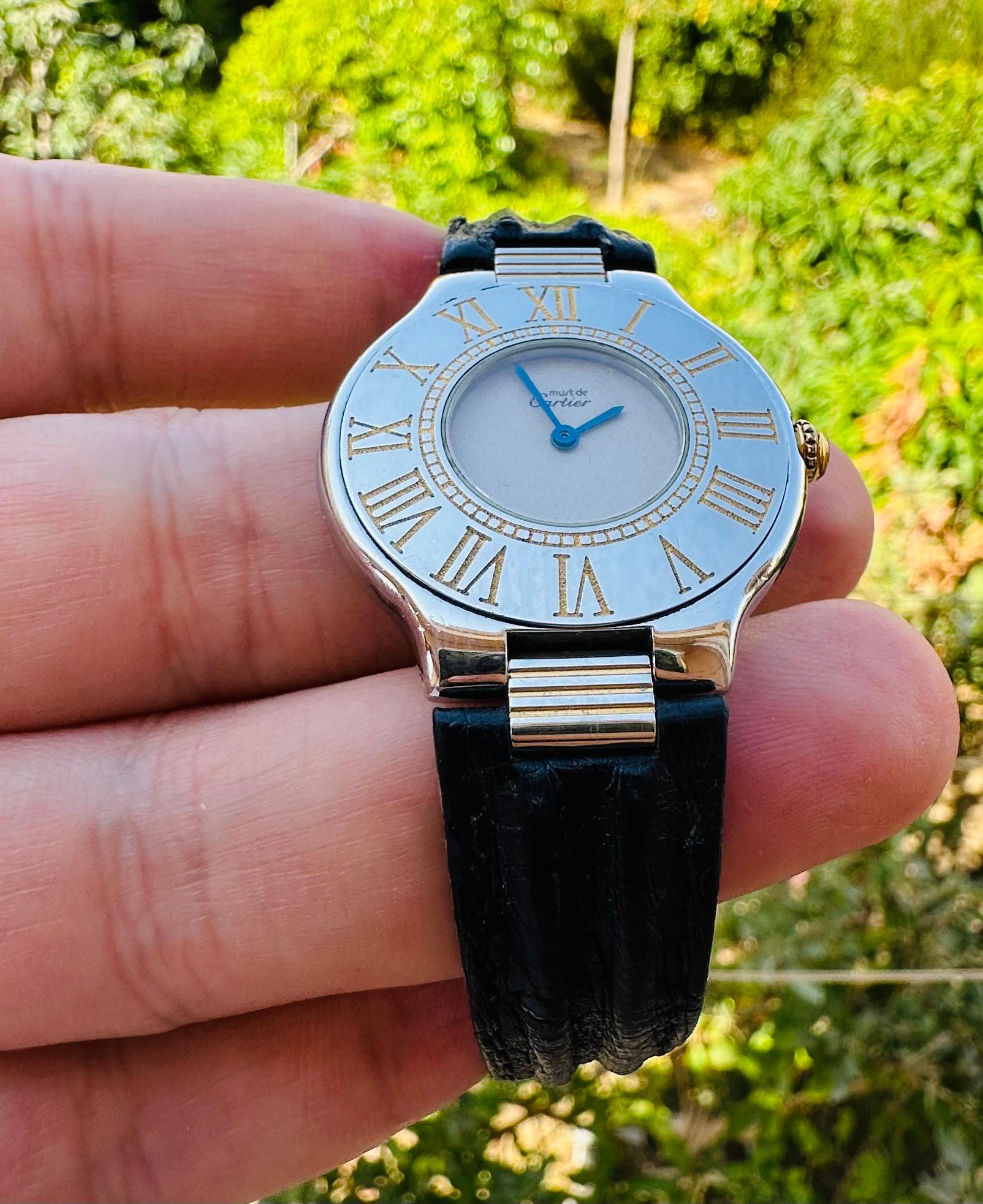 Brand: Cartier

Model: Cartier 21 Must de Cartier

Reference Number: 9011

Country Of Manufacture: Switzerland

Movement: Quartz

Case Material: Leather

Measurements : 31mm (without crown)

Band Type : Gold Plated &Stainless steel

Band Condition :