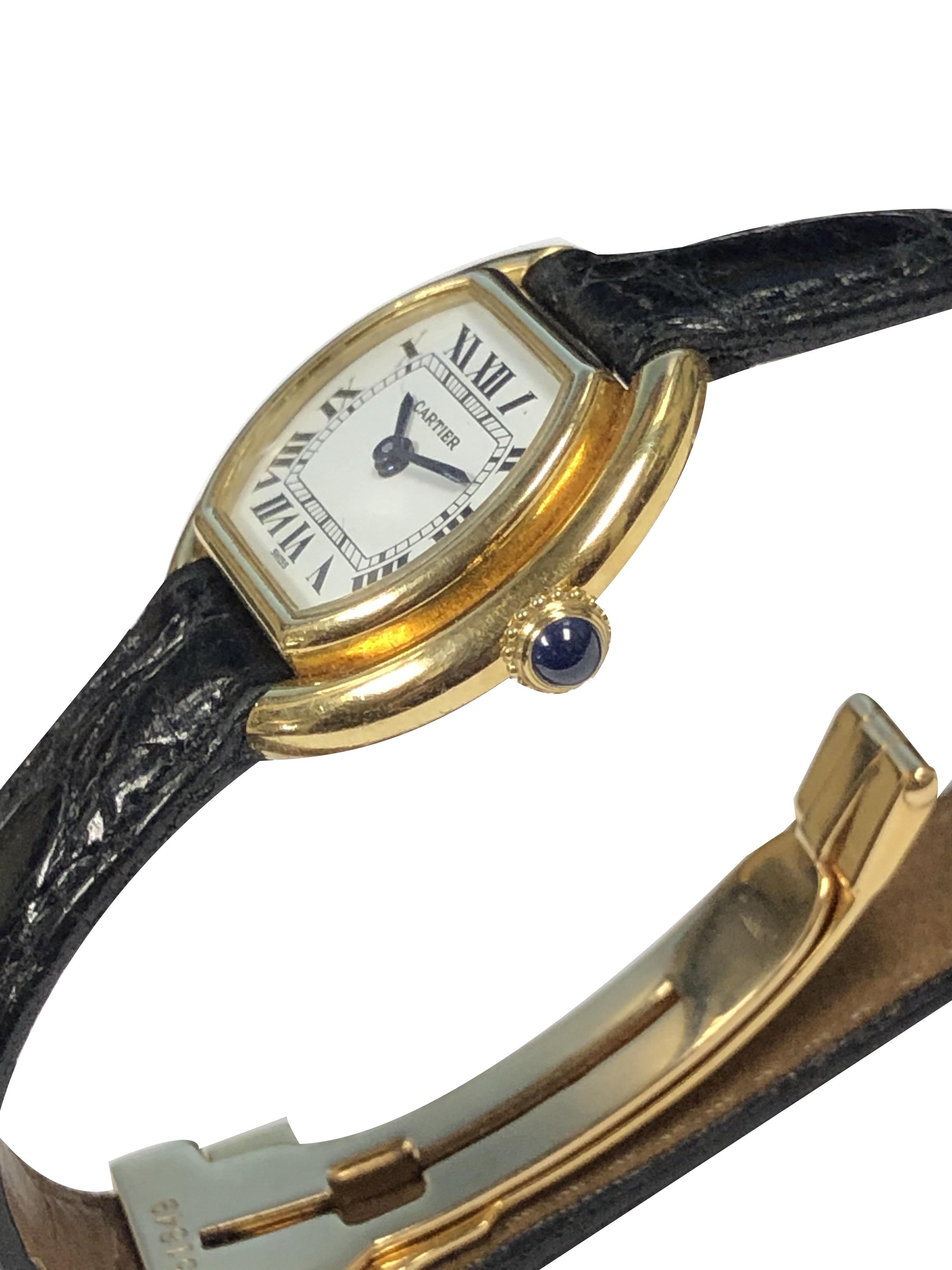 Circa 1970s Cartier Centure collection Wrist Watch, 23 X 26 M.M. 18K Yellow Gold 2 piece stepped case, Sapphire Crown, 17 Jewel Mechanical, manual wind movement.  White Dial with Black Roman numerals. Original Cartier Black Croco Strap with Cartier