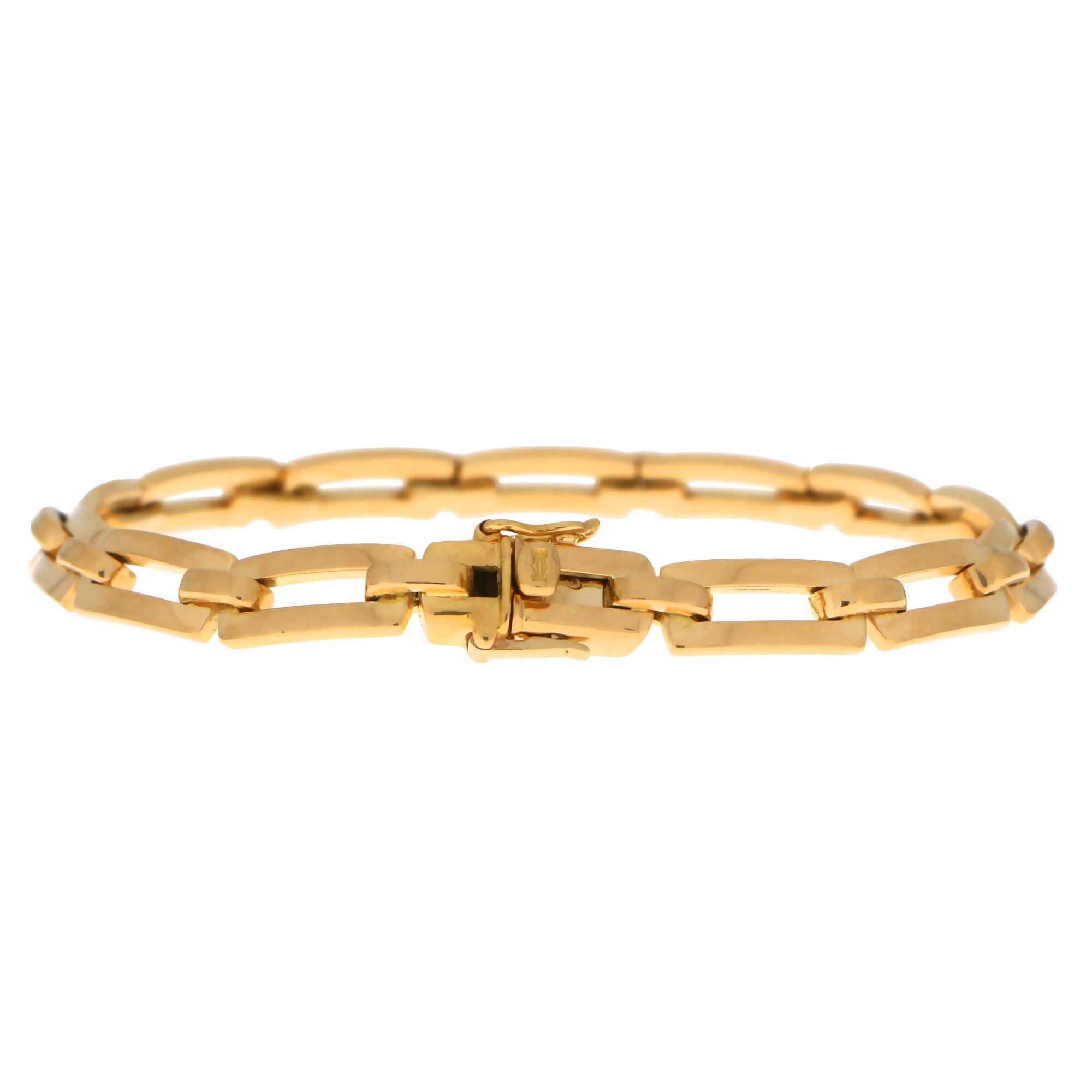 A simple yet incredibly beautiful Cartier chain link bracelet made of solid 18k yellow gold.

The bracelet is composed of 13 rectangular links and sits beautifully on the wrist. Due to the design of the bracelet it could easily be worn by itself as