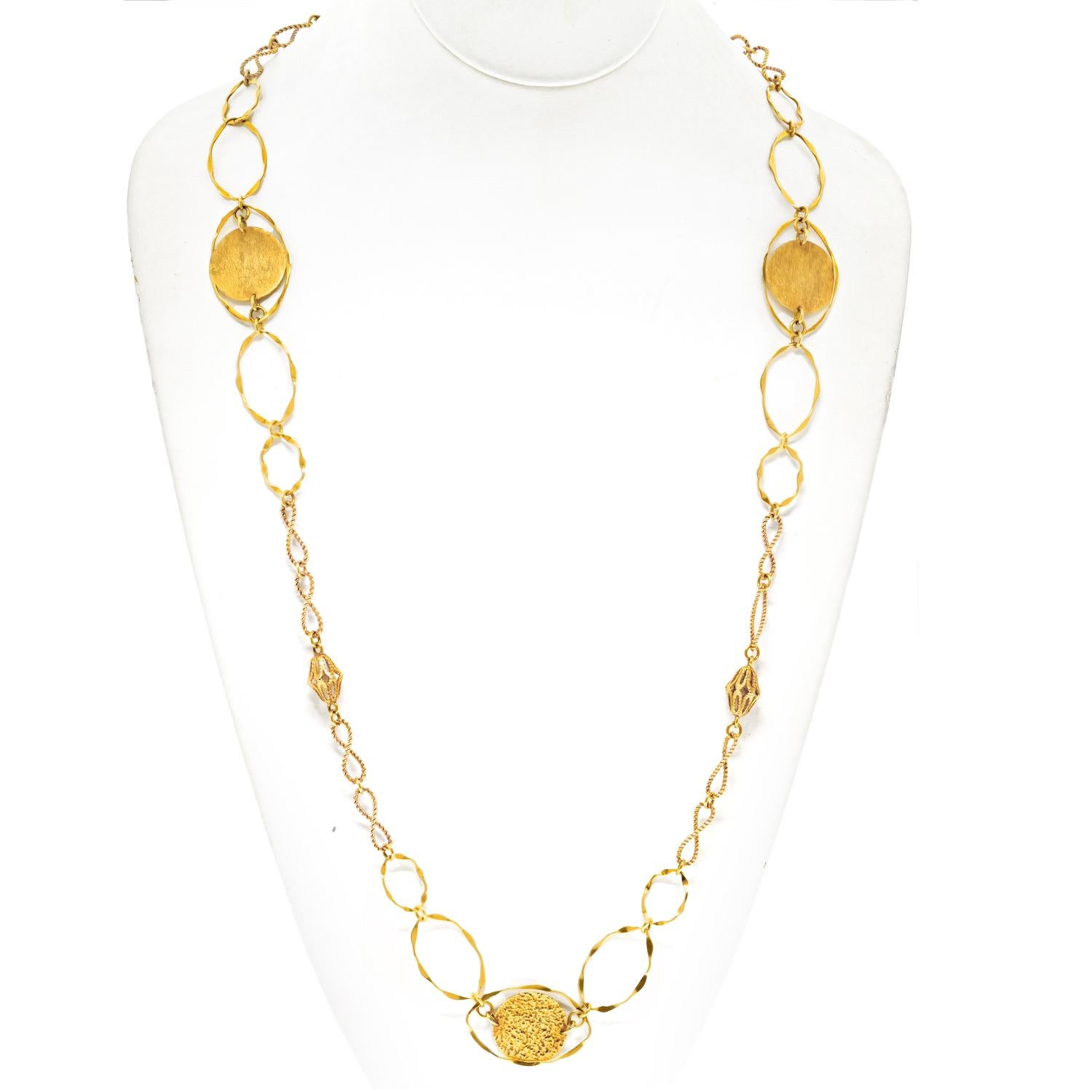 This Cartier Vintage 18K Yellow Gold Wire Twist Disk Chain Necklace from the 1970s is a rare and elegant find. Measuring 34 inches in length and weighing 41.4 grams, this piece showcases the exquisite craftsmanship Cartier is known for. 

The