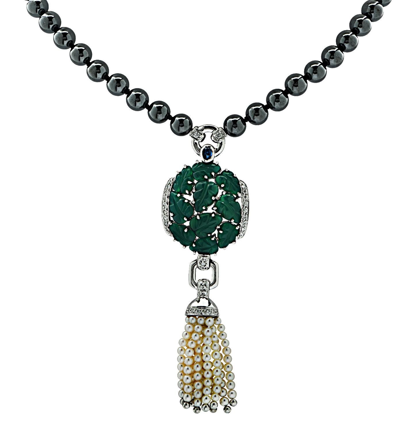 From the House of Cartier,  this stunning sautoir necklace showcases Cartier timeless style. Reminiscent of the art deco era, this sensational necklace features a tassel with 10 delicately carved chrysoprase leaf motifs framed with 33 round