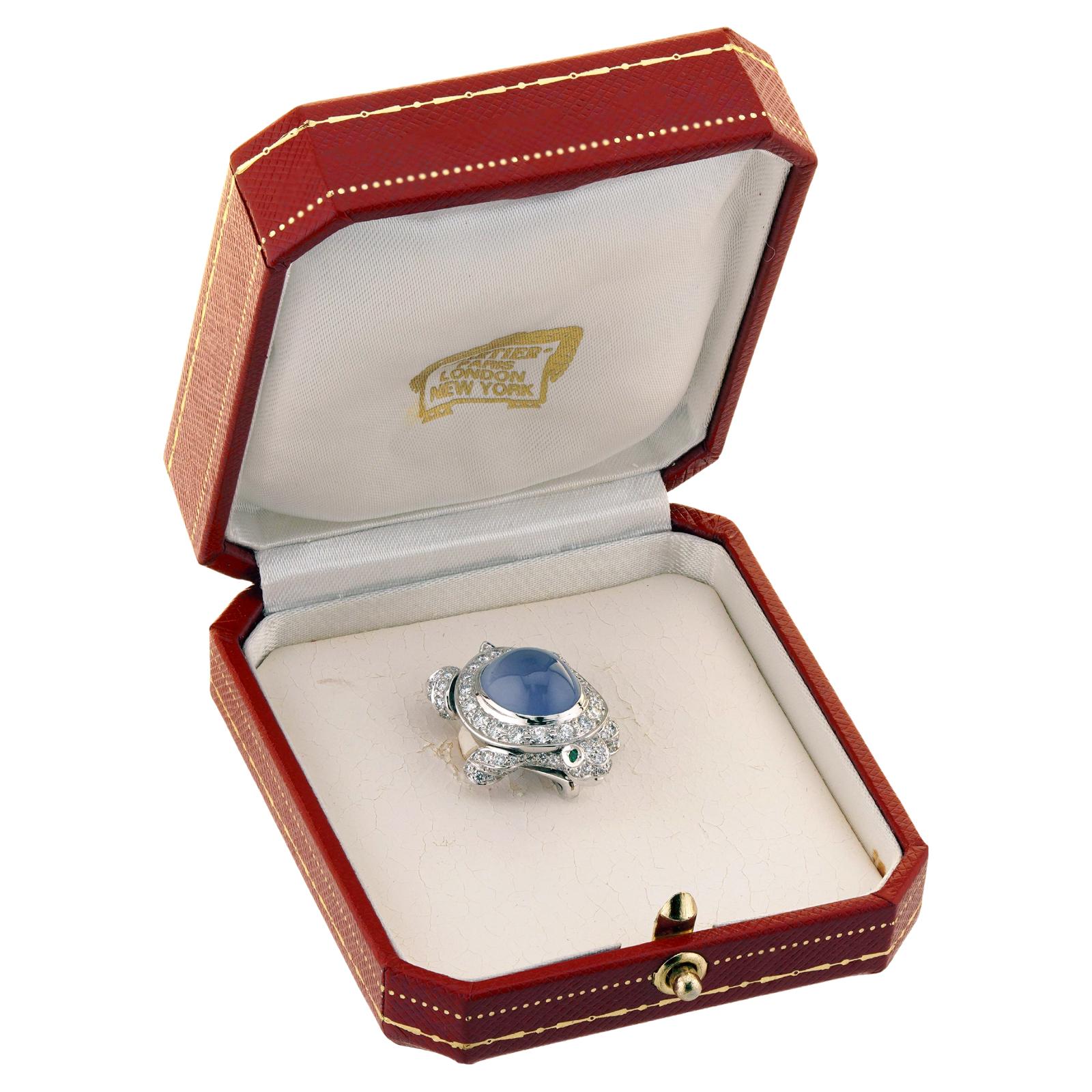 This adorable Cartier pin brooch is crafted in 18k white gold and set with an oval 12.0mm x 14.0mm chalcedony body, 2 round emearld eyes, and 123 round brilliant-cut VVS1 E diamonds weighing an estimated 3.0 carats.  Made in France circa 2001.
