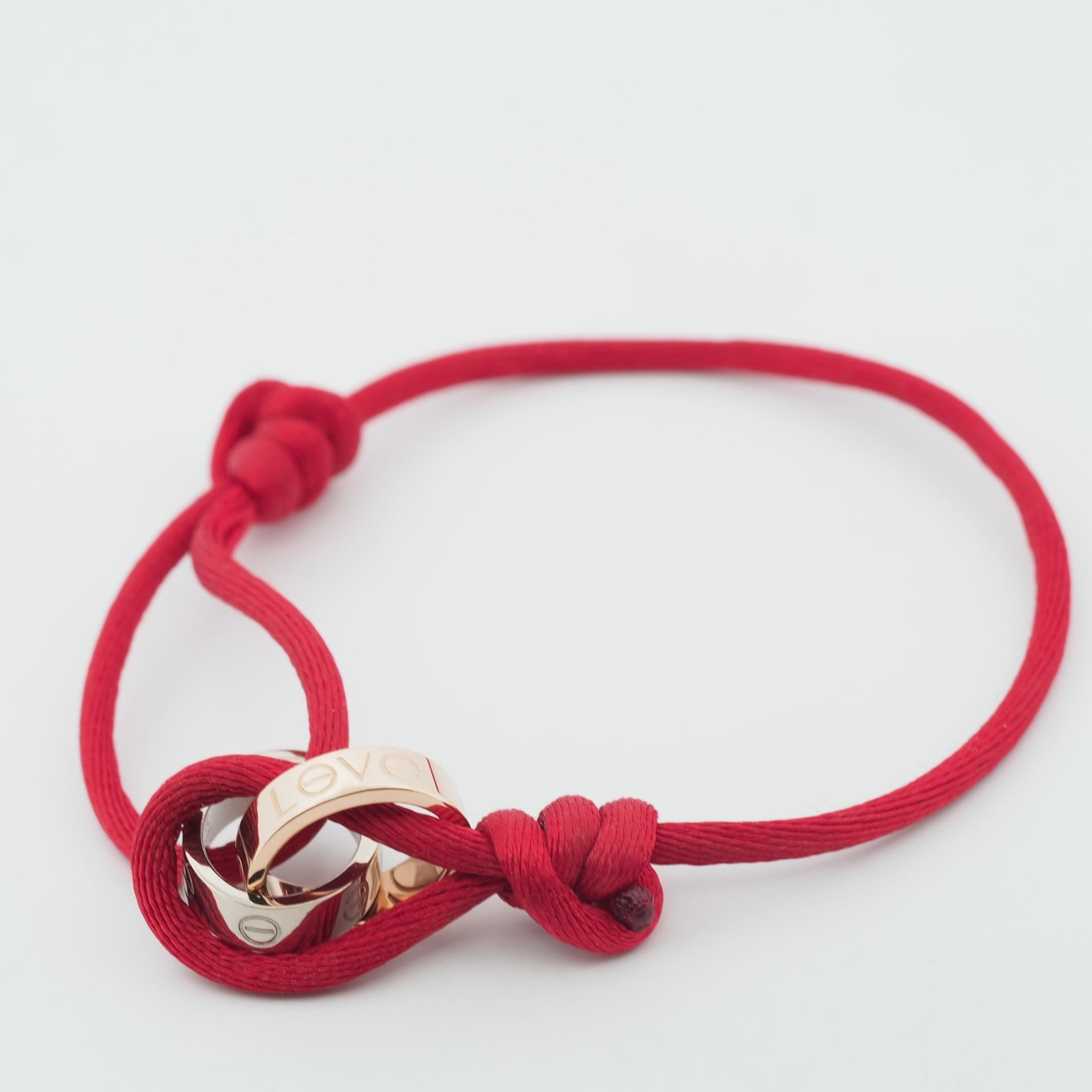 Artikel: Authentisches Cartier Charity-Liebesarmband 
Stein: ---
Metall: 18K Weiß- und Roségold
Länge der Corde: Einstellbar
Gewicht: 6,0 Gramm (insgesamt)
Liebesmotiv Durchmesser: 13 mm (einzeln)
Zustand: Gebraucht (neu poliert), Die Kordel weist