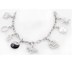 Cartier, bracelet à breloques en or blanc 18 carats avec 8 breloques