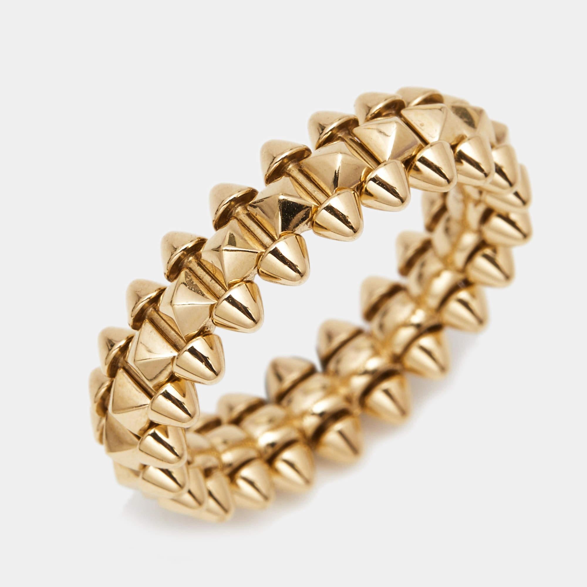 The Cartier Clash de Cartier ring is an exquisite piece of jewelry that showcases a harmonious blend of elegance and edginess. Crafted from luxurious 18k rose gold, the ring features a dynamic design with studded pyramid-shaped motifs, creating a