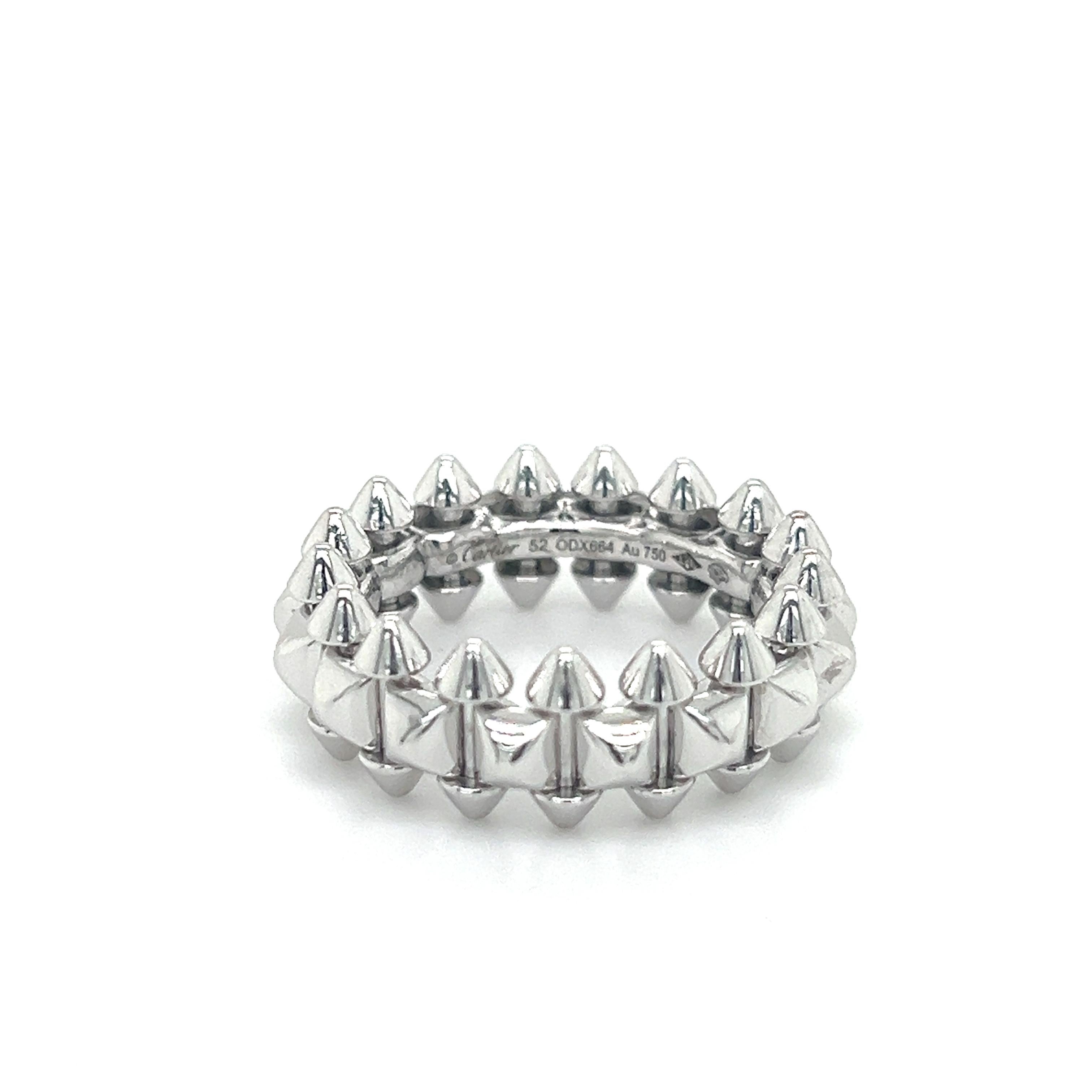 Beautiful ring from famed designer Cartier. The ring is from the Clash de Cartier collection. This model is crafted in 18k white gold with a rhodiumized finish, it is the medium model of the design showing a 8 mm width. 
The design shows spikes at