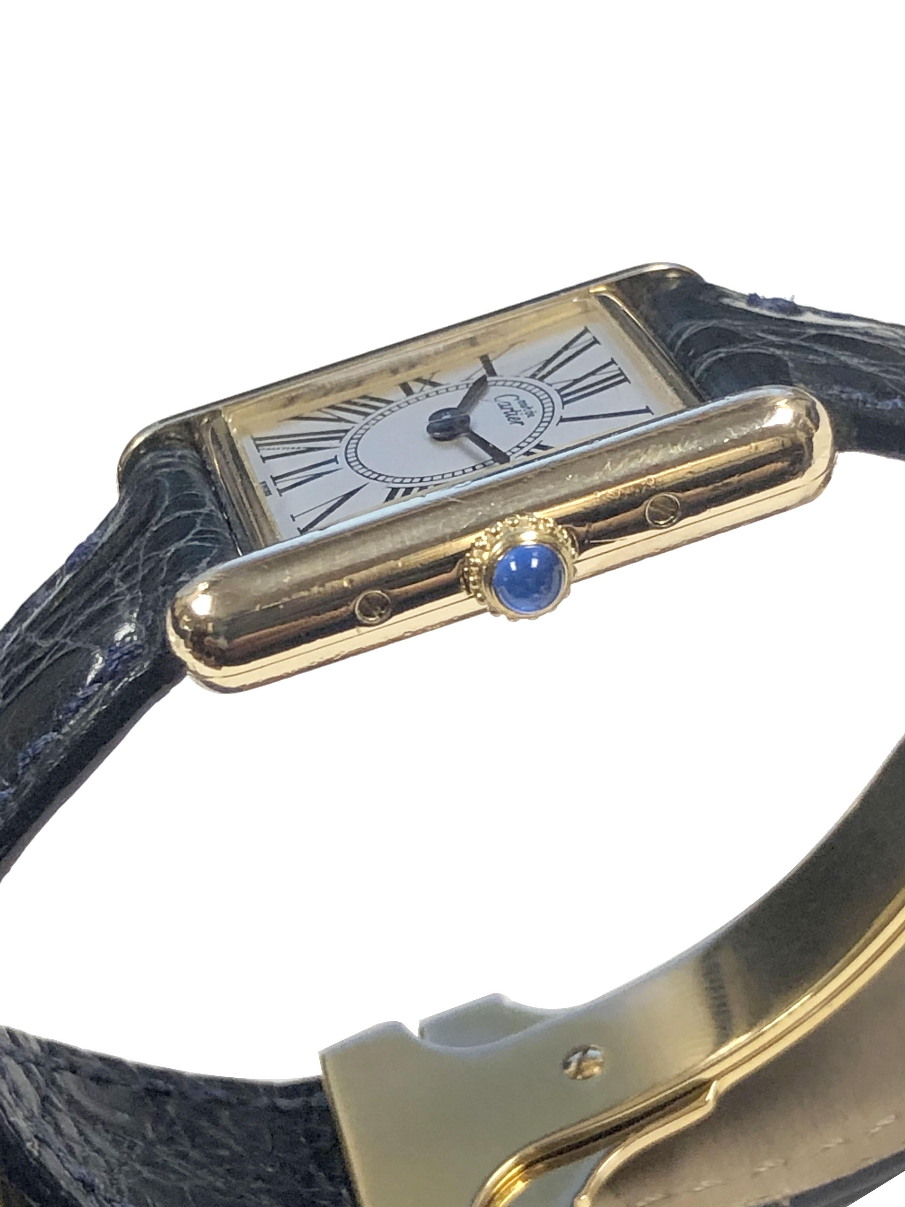 Circa 2000 Cartier classic Ladies Tank Wrist Watch, 28 X 20 M.M. 2 Piece Vermeil ( Gold plate on 925 Sterling Silver ) case. Quartz movement, Silver Dial with Black Roman Numerals and a sapphire crown. Original Cartier Black Croco Strap with