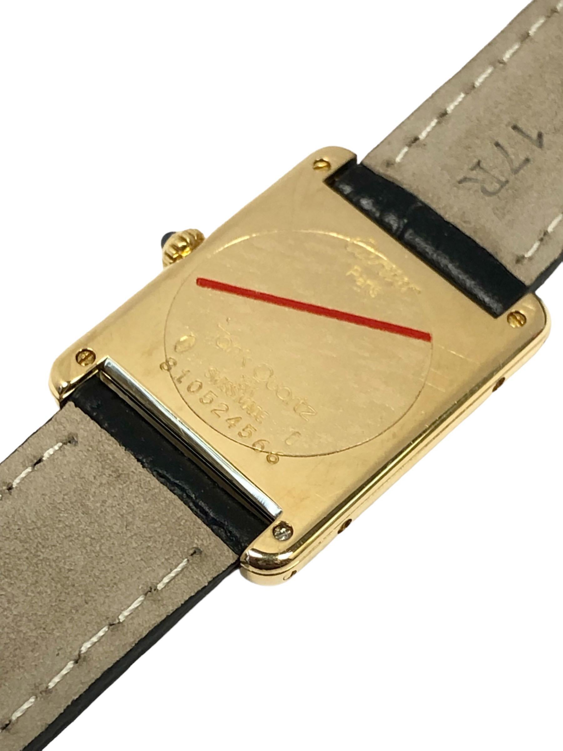 Circa 2000 Cartier Louis Cartier mid size Tank Wrist Watch, 30 X 23 M.M. 2 Piece 18K yellow Gold case, Quartz movement, Sapphire Crown, White Dial with Black Roman numerals. New Hadly Roma  Black Croco grain strap with a Cartier Gold Plate Tang