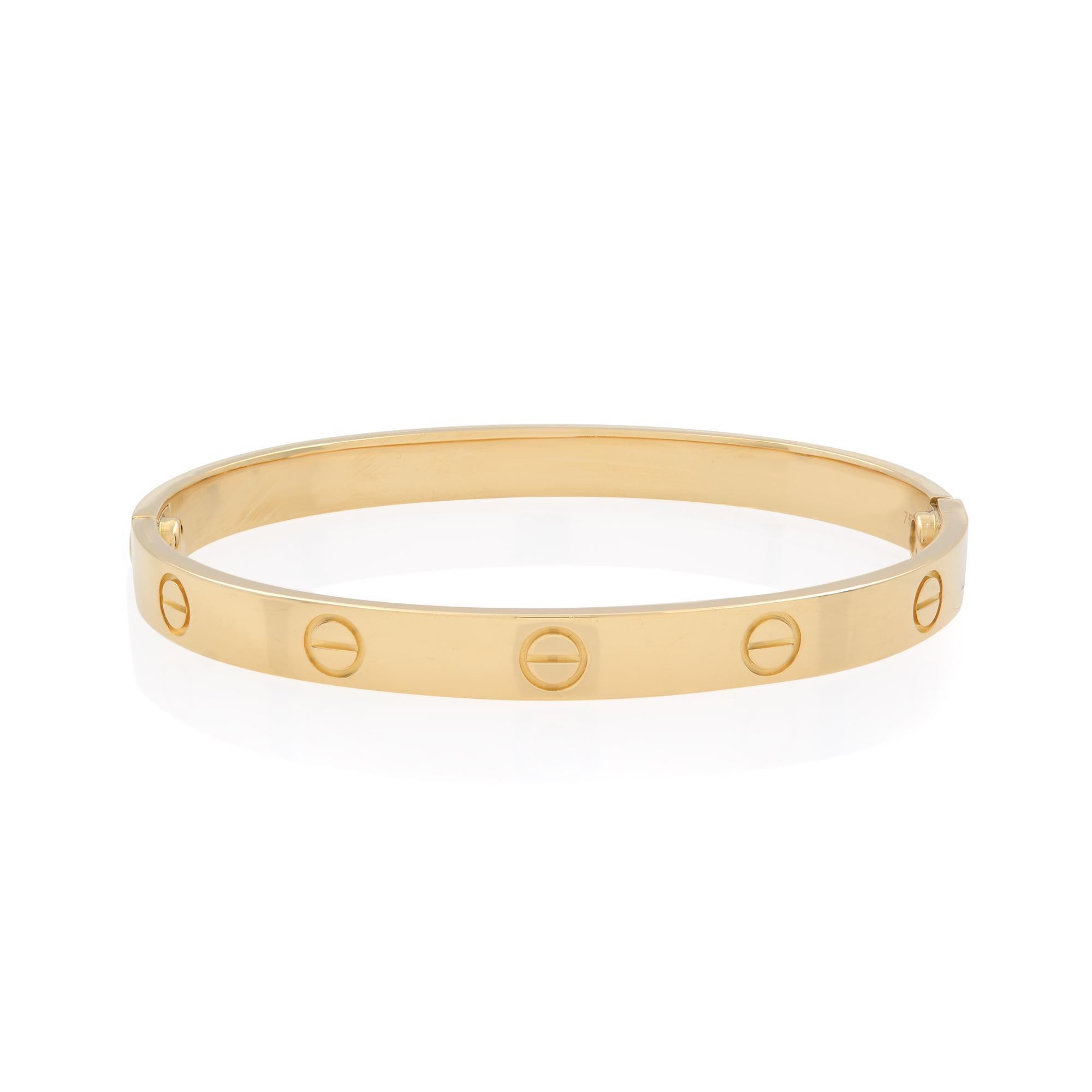 Cartier classic 18k yellow gold love bangle bracelet size 17. Width: 6.1mm. New style screw system. Excellent pre owned condition. Chronostore appraisal included. Comes with a screw driver. Original box and papers are not included.