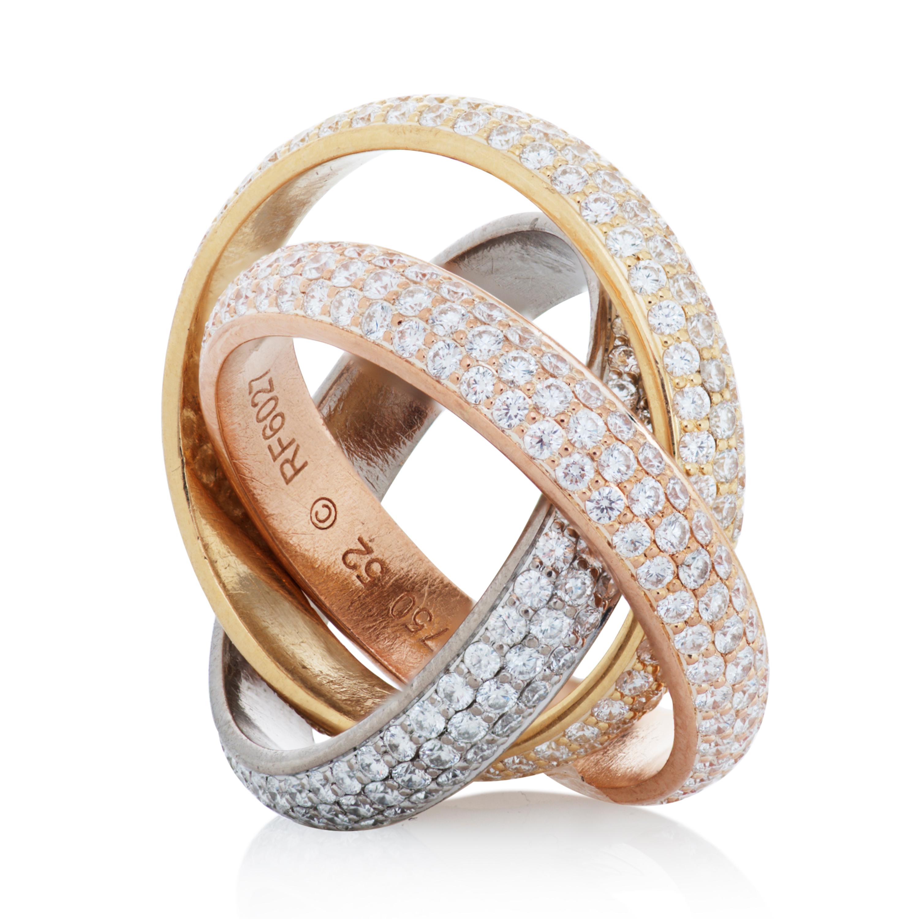 Cartier classic model diamond Trinity rolling ring in 18k white, yellow and rose gold. 

This Cartier ring features 3 interlocking bands pave set with approximately 2.98 carats of round brilliant cut diamonds, it is accompanied by Cartier box.