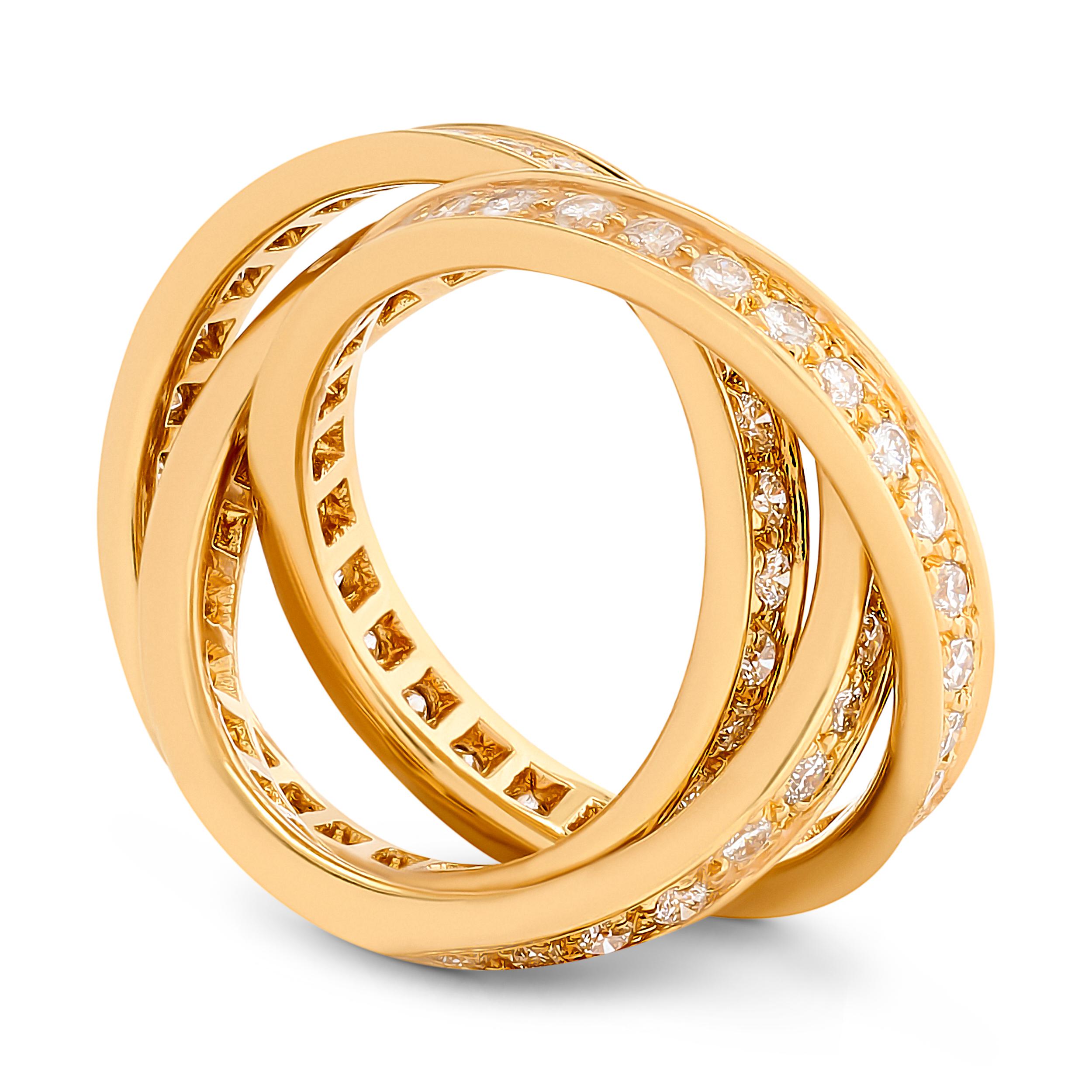 Der Cartier-Diamant-Trinitätsring aus 18 Karat Gelbgold besticht durch einen harmonischen Tanz von Diamanten und Gold, der bei jeder Drehung Eleganz ausstrahlt.

Dieser Ring von Cartier besteht aus 3 ineinandergreifenden Bändern, die mit ca. 1,55