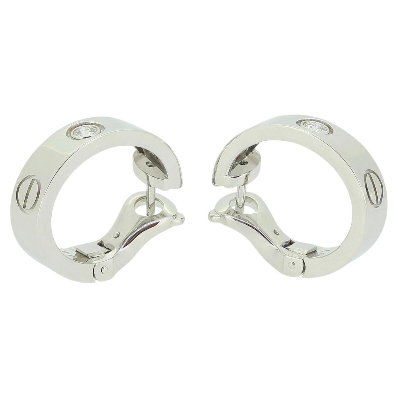 How do you open Cartier Love earrings?