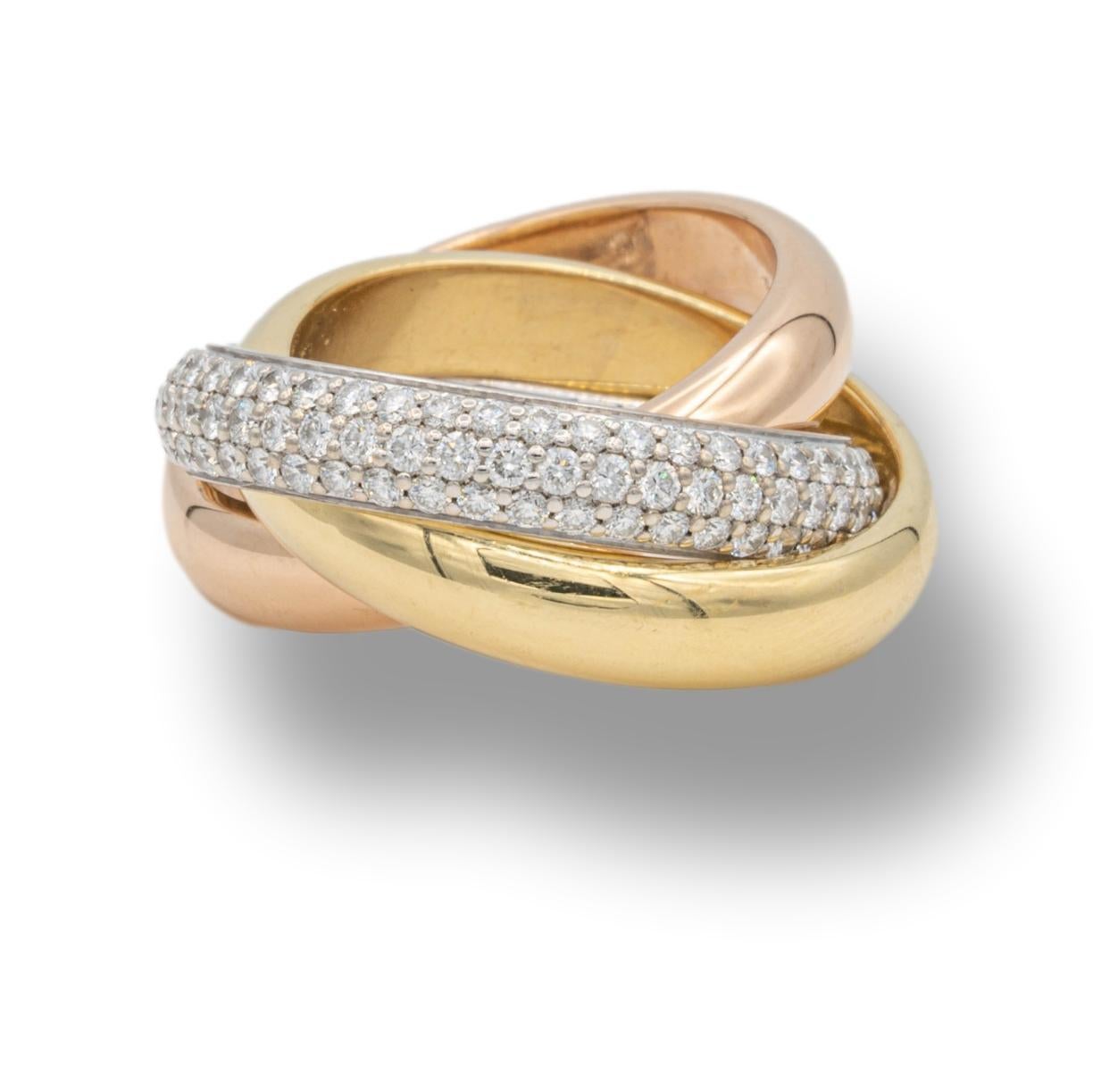 Cartier rolling ring from the classic trinity collection finely crafted in 18 karat yellow, white and rose gold. The white gold band is encrusted with 144 brilliant-cut pave set diamonds totaling 1.25 carats. D - F color VVS clarity 

Stamp: Cartier