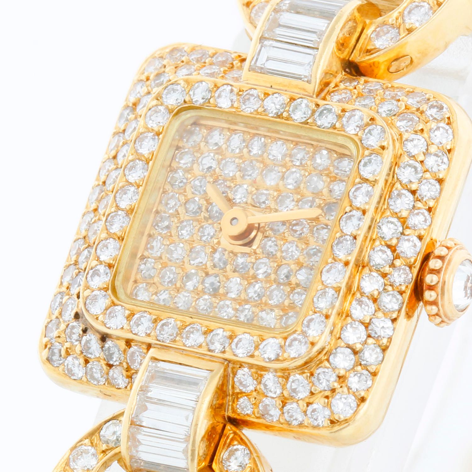 Cartier Classique Pearl & Diamond Ladies Watch  - Manual winding . 18K Yellow gold pave diamond case with baguette diamond lugs (19 x 19 mm) . Pave diamond dial . Five rows of pearls bracelet with 18K yellow gold diamond clasp; will fit a 5.5 inch