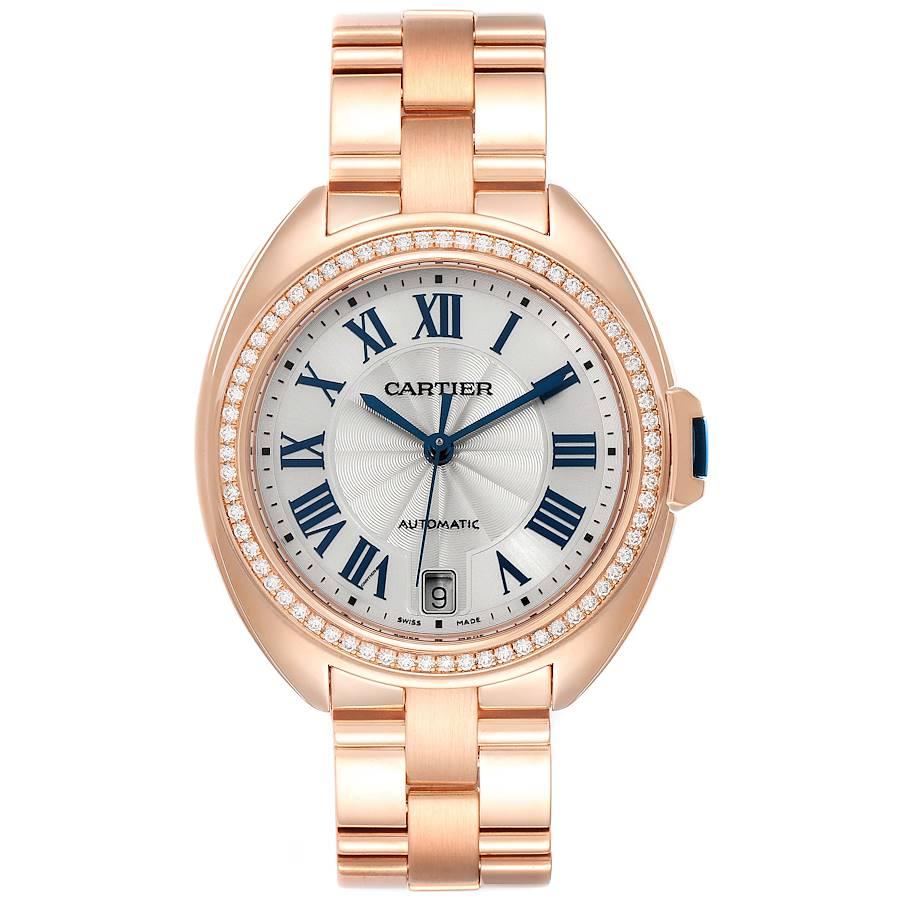 Cartier Cle 18K Rose Gold Diamond Automatic Ladies Watch WFCL0003. Automatic self-winding movement. Round 18K rose gold case 35 mm in diameter. Flush-mounted crown set with the blue sapphire cabochon. 18K rose gold original Cartier factory diamond