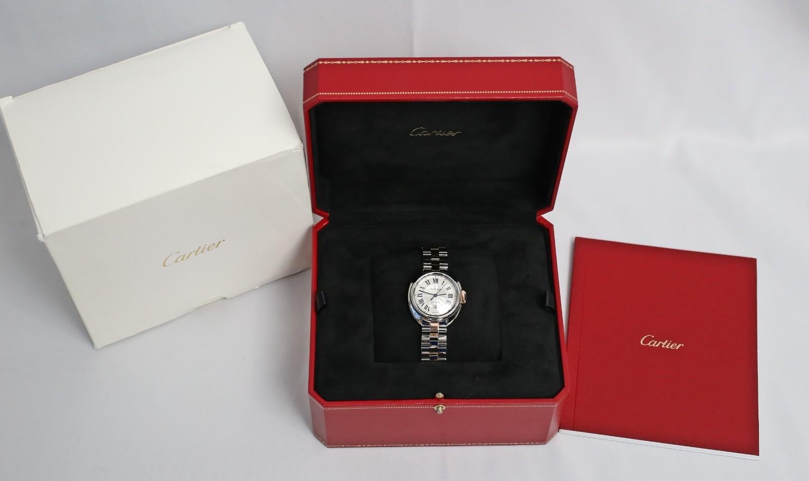 Sofisticato e moderno, questo autentico Cartier Clé de Cartier Automatic (Ref. 3867) è presentato completo di scatola e documenti Cartier. L'elegante cassa da 40 mm in acciaio inossidabile è completata da accenti in oro rosa 18 carati, abbinati a un