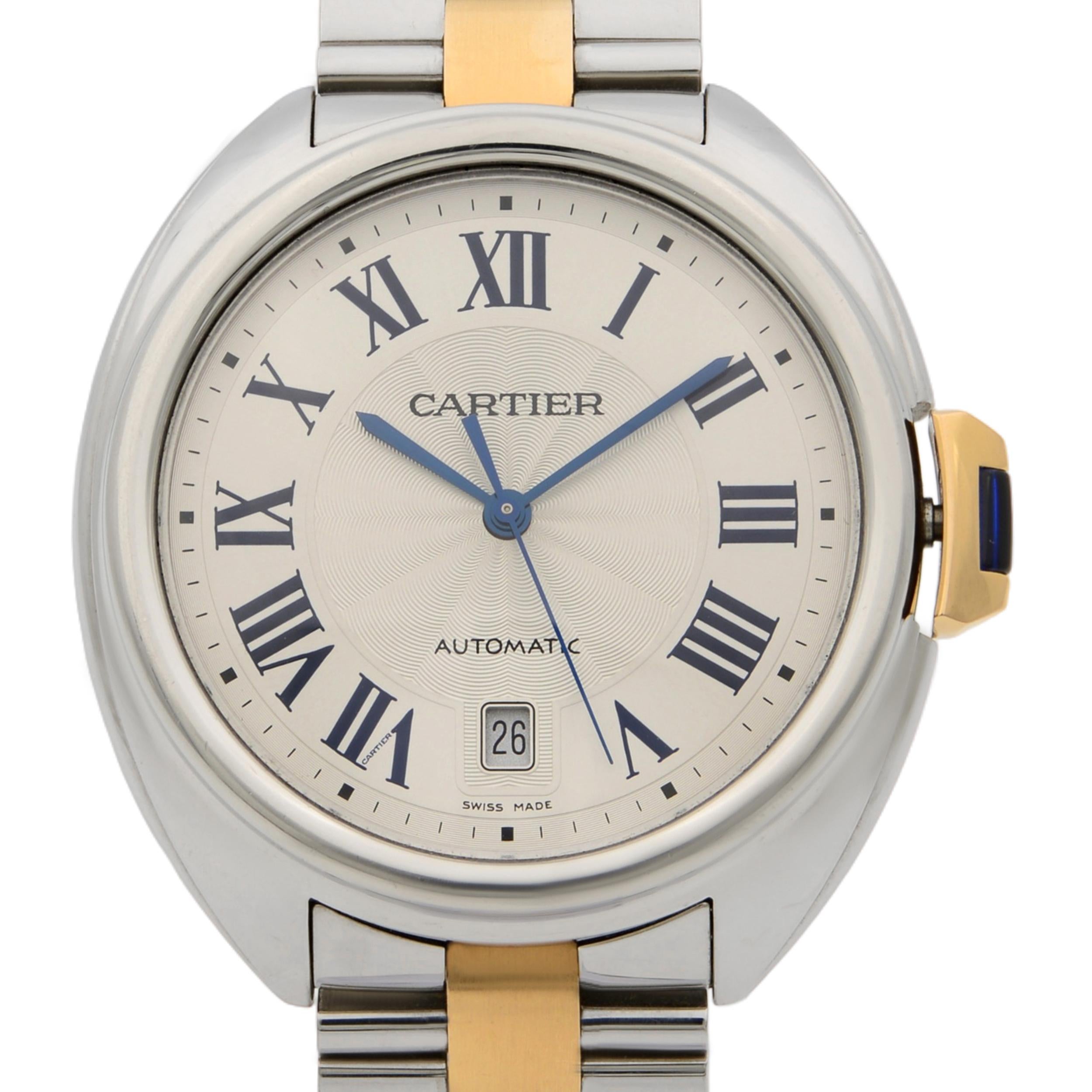 This pre-owned Cartier Cle De Cartier W2CL0002 is a beautiful men's timepiece that is powered by mechanical (automatic) movement which is cased in a stainless steel case. It has a round shape face, date indicator dial and has hand roman numerals