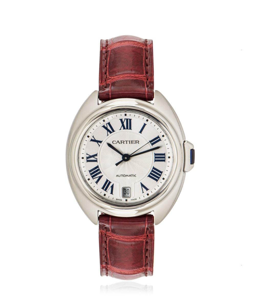 A ladies 35mm Cle De Cartier wristwatch crafted in stainless steel. Featuring a silver guilloche dial with a date aperture, blued-steel sword-shaped hands, Cartier's own hidden signature at VII and a fixed stainless steel bezel as well as a crown
