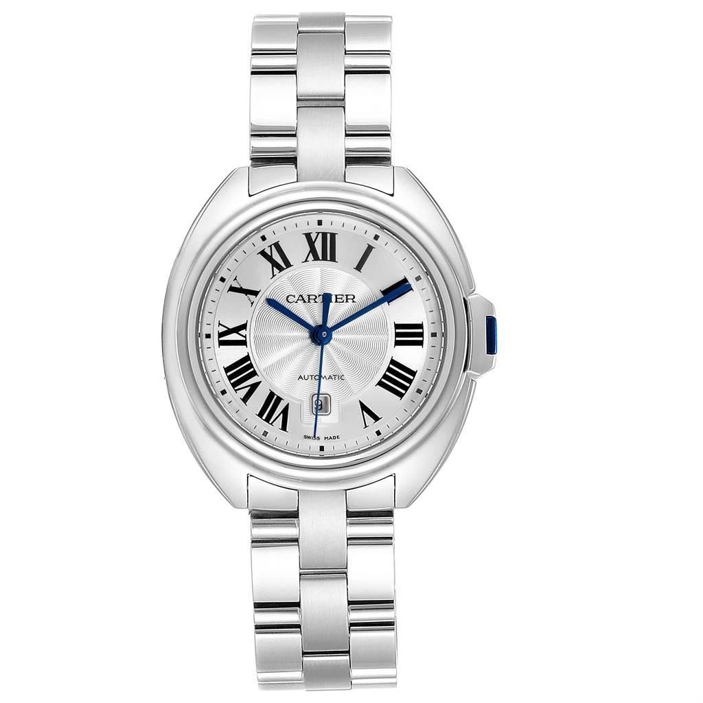 Cartier Cle Silver Guilloche Dial Automatic Steel Ladies Watch WSCL0005. Automatic self-winding movement. Round stainless steel case 31 mm in diameter. Flush-mounted crown set with the blue spinel cabochon. Stainless steel smooth bezel. Scratch